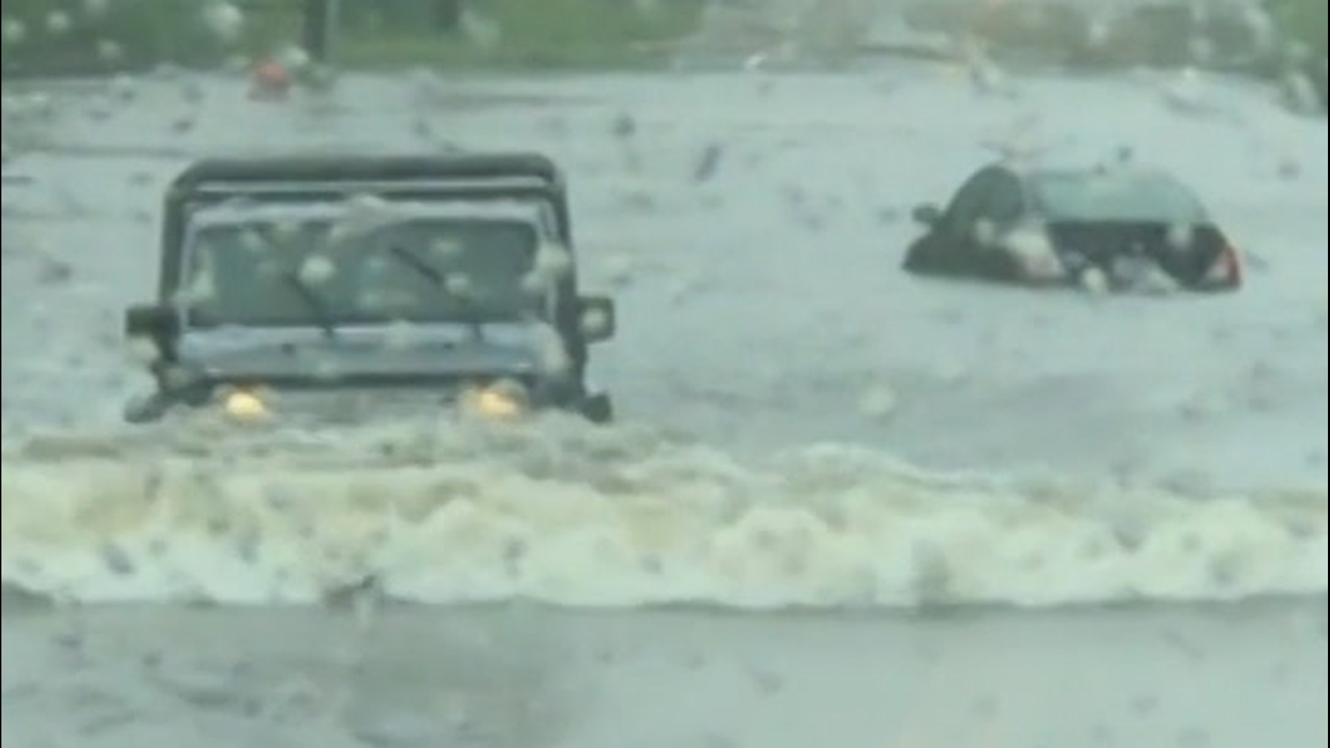 Despite deep floodwaters, drivers attempted to drive through this road in Pensacola, Florida, in mid-September, as Hurricane Sally soaked the Gulf Coast region, triggering widespread flash flooding.