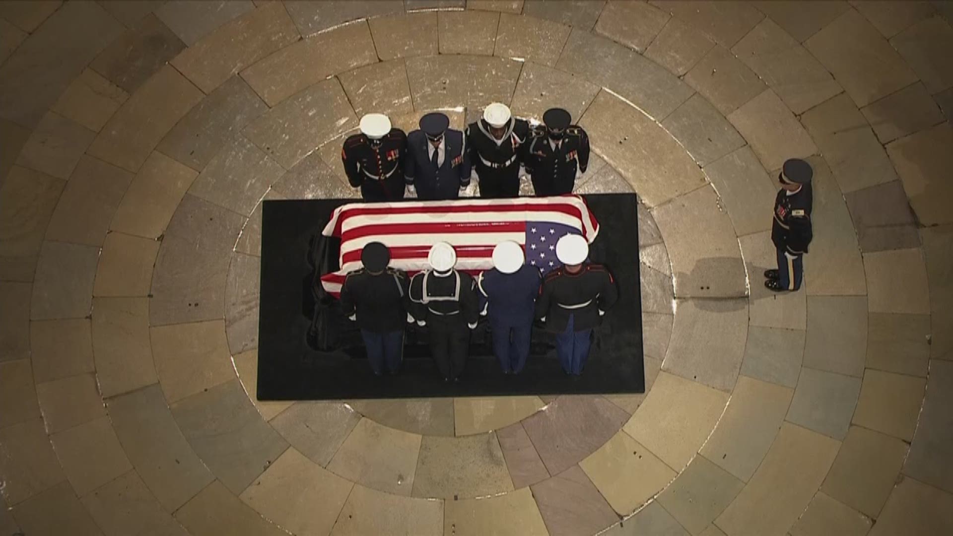 After a procession from Joint Base Andrews through Washington, a military honor guard carried the casket of former President George H.W. Bush into the rotunda of the U.S. Capitol.