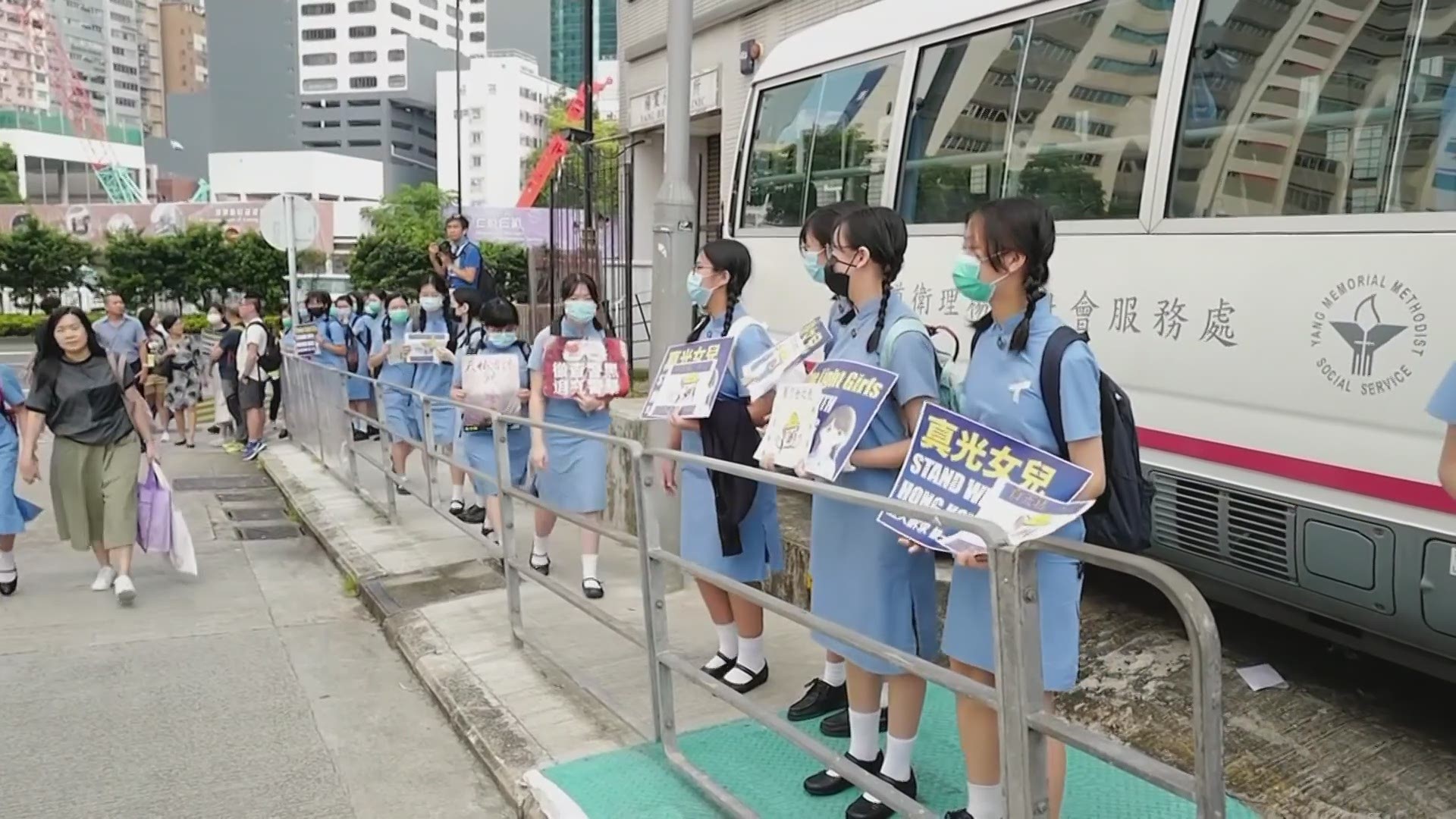 Thousands of students formed human chains outside schools across Hong Kong on Monday to push for democratic reforms. (AP)