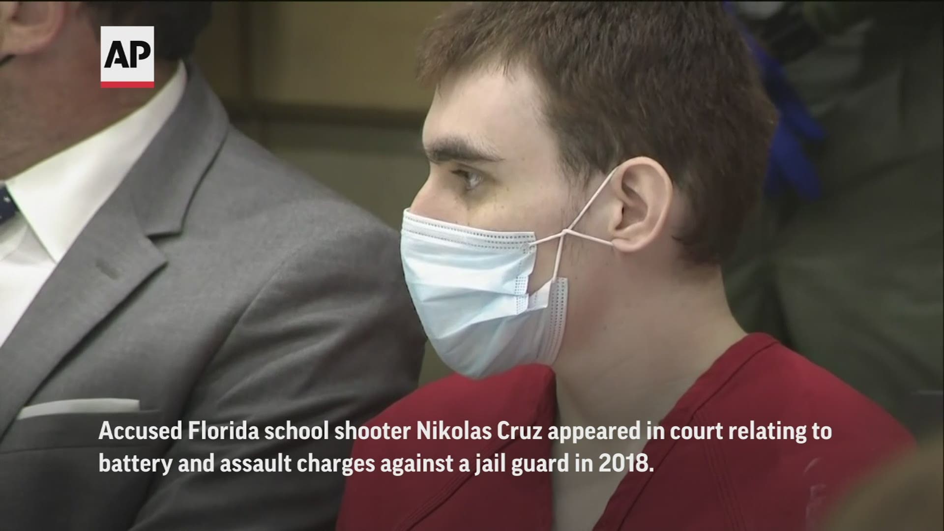 Accused Florida school shooter Nikolas Cruz rushed at a jail guard and was briefly able to wrestle him to the ground during a 2018 altercation, video shows.
