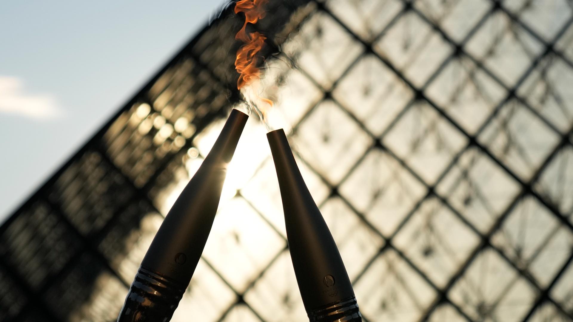 Who is lighting the Olympic cauldron at the Opening Ceremony?