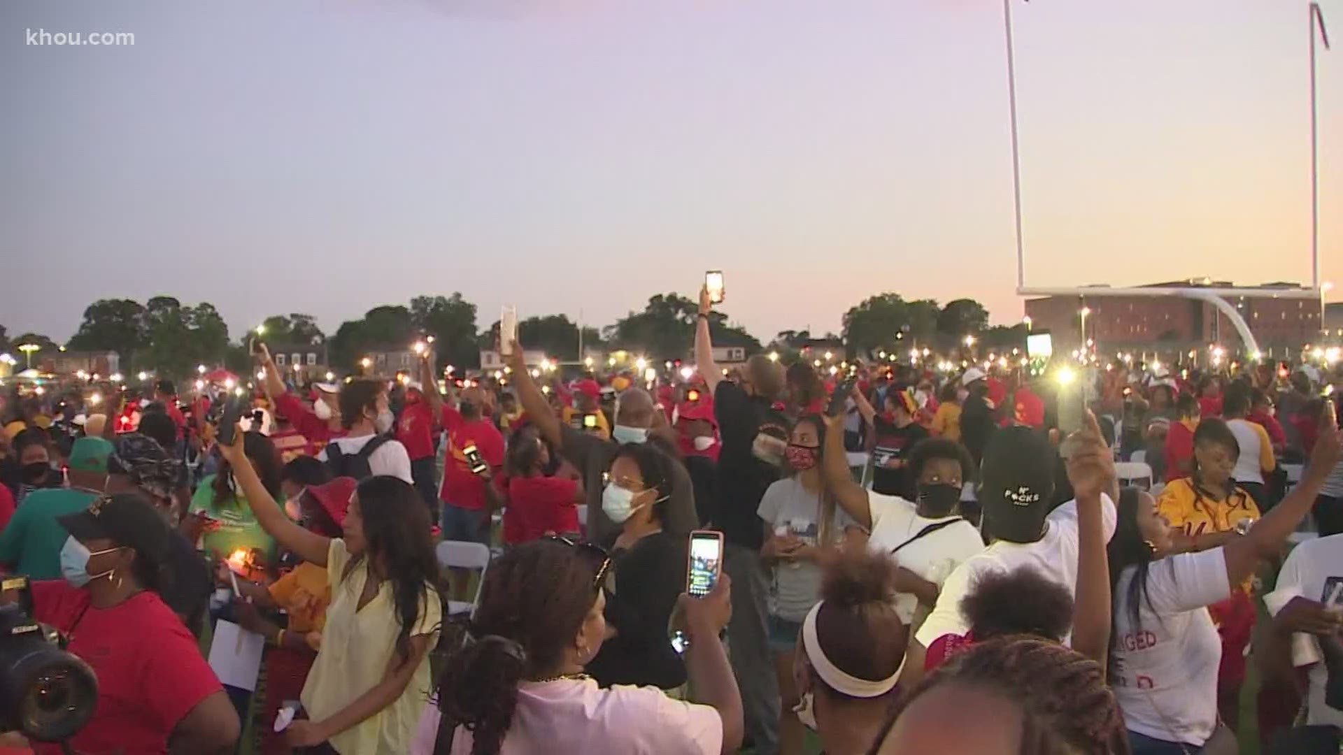 Hundreds showed up for a candlelight vigil Monday honoring George Floyd at Jack Yates High School in Houston’s Third Ward.