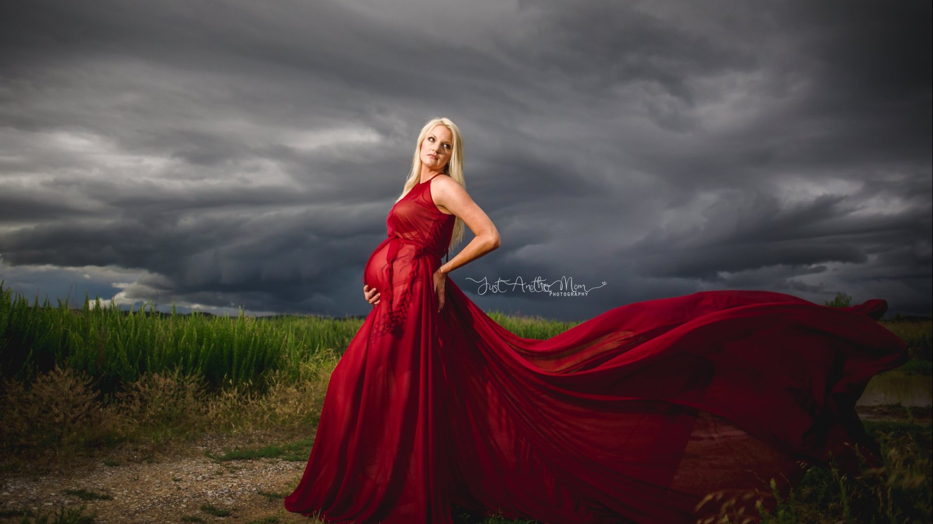 'Mother Nature had nothing on this momma' | The gorgeous clouds were a happy accident, owner of Just Another Mom Photography Tracy Hibben said.