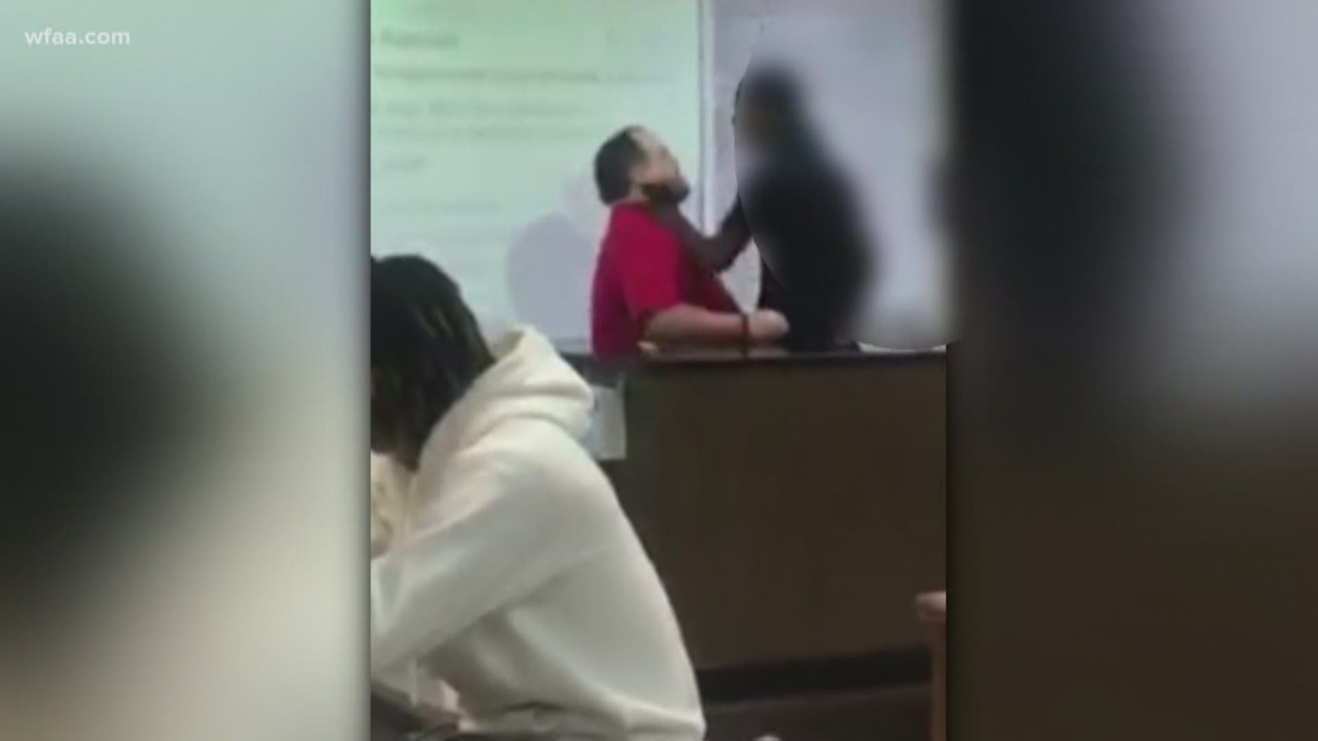 Student shoves teacher by the neck