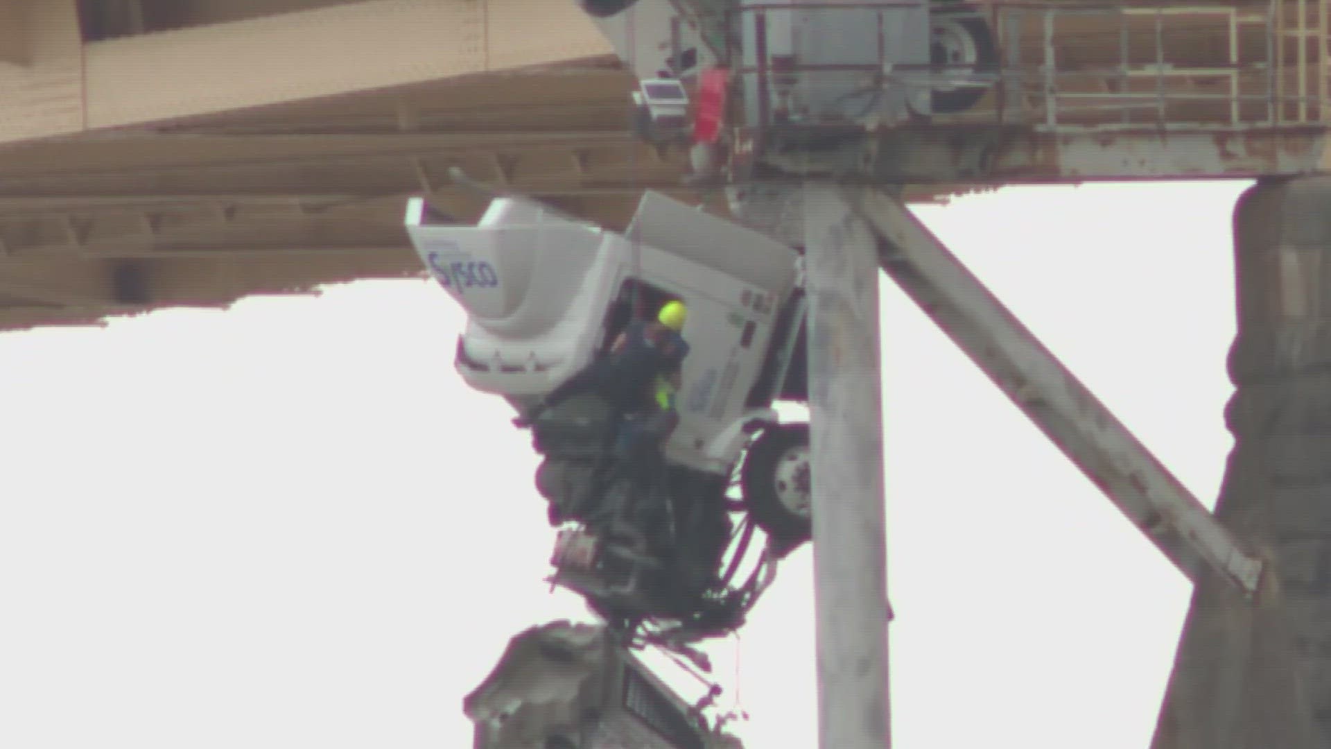 A harrowing scene as a semi-truck was left hanging over the Second Street Bridge in Louisville on Friday.