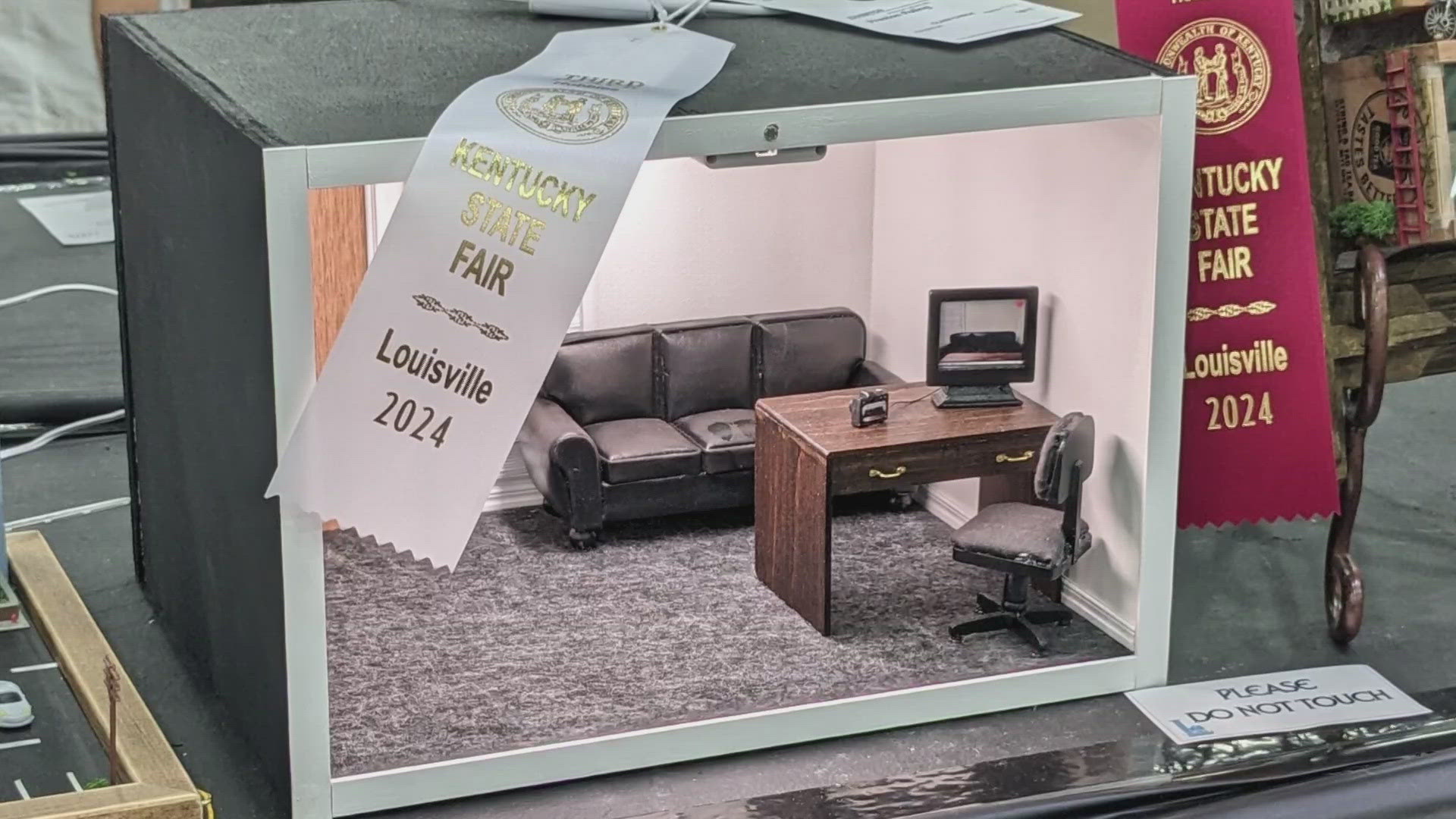 State fair officials were shy about giving a reason as to why the Bearded Miniaturist's 'casting couch' display was removed despite winning third place.