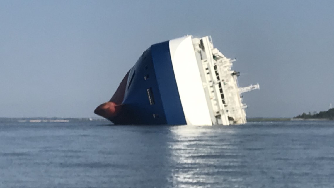 Coast Guard rescues 18, four unaccounted for after cargo ship overturns