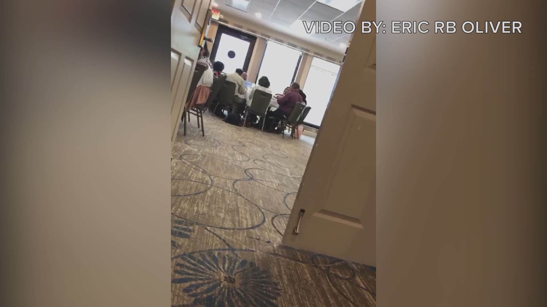 A customer at Ruth's Chris Steak House shot this video Sunday of servers bringing food to patrons in a Double Tree Hotel banquet room in downtown Jacksonville.