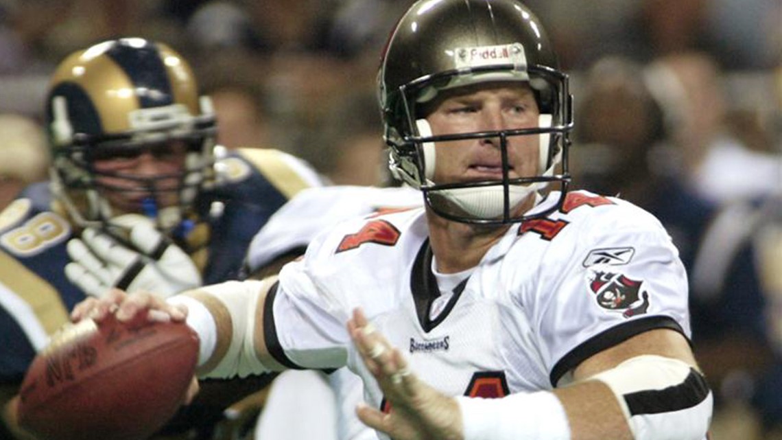 Dec. 9, 2012 - Tampa, Florida, U.S. - Tampa Bay Buccaneers 2002 Superbowl  team QB Brad Johnson gets a high five from the Bucs mascot as he runs onto  the field as