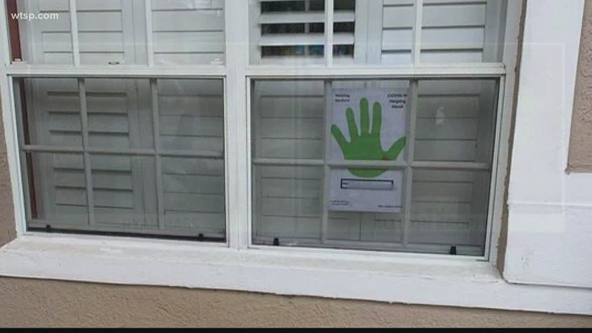 A family in Oldsmar is letting neighbors, especially seniors, know they can help with a universal sign they call the "COVID-19 Helping Hand."