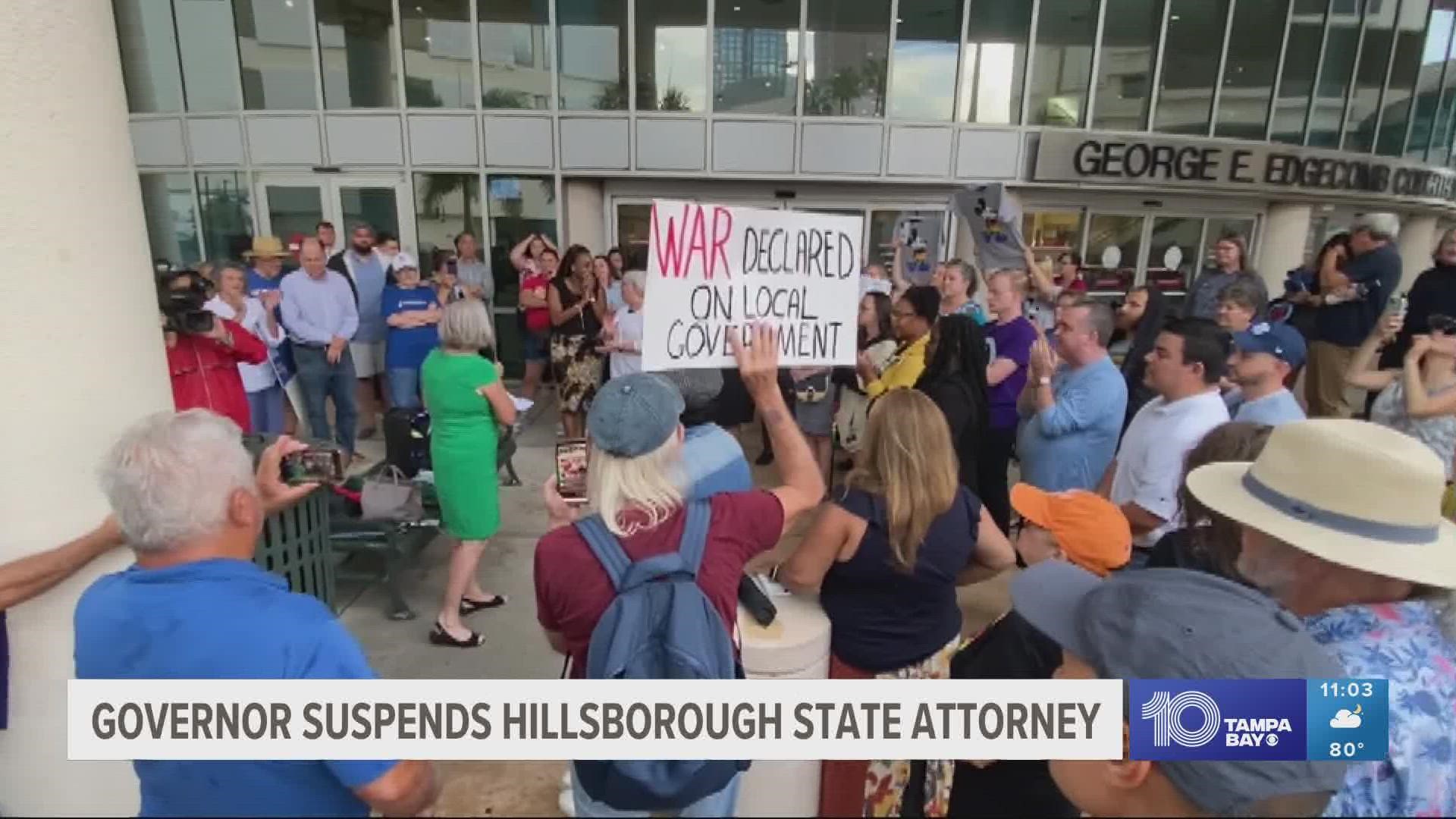 Nearly 100 people gathered outside the Hillsborough County Courthouse in support of Warren.