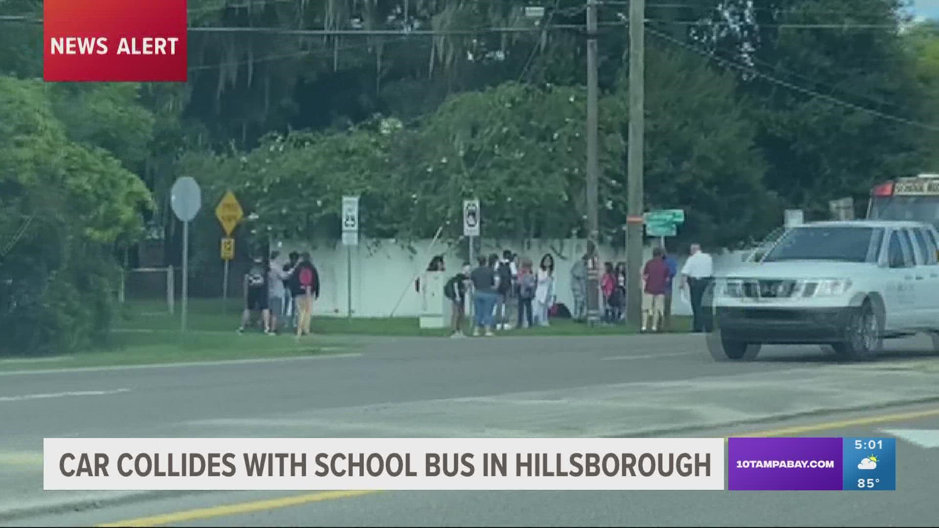 Students were seen standing outside of the school bus while deputies responded to the crash.