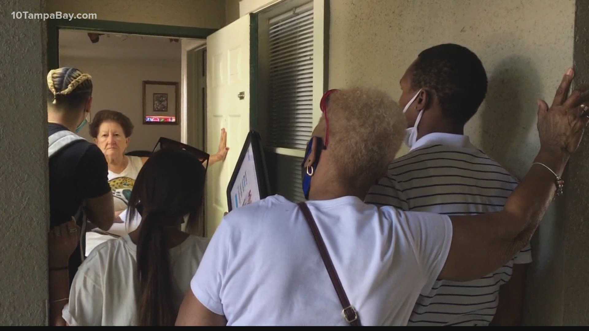 Canvassers are going door-to-door in mostly underserved neighborhoods to let people know about the availability of COVID vaccines and how they can get them.