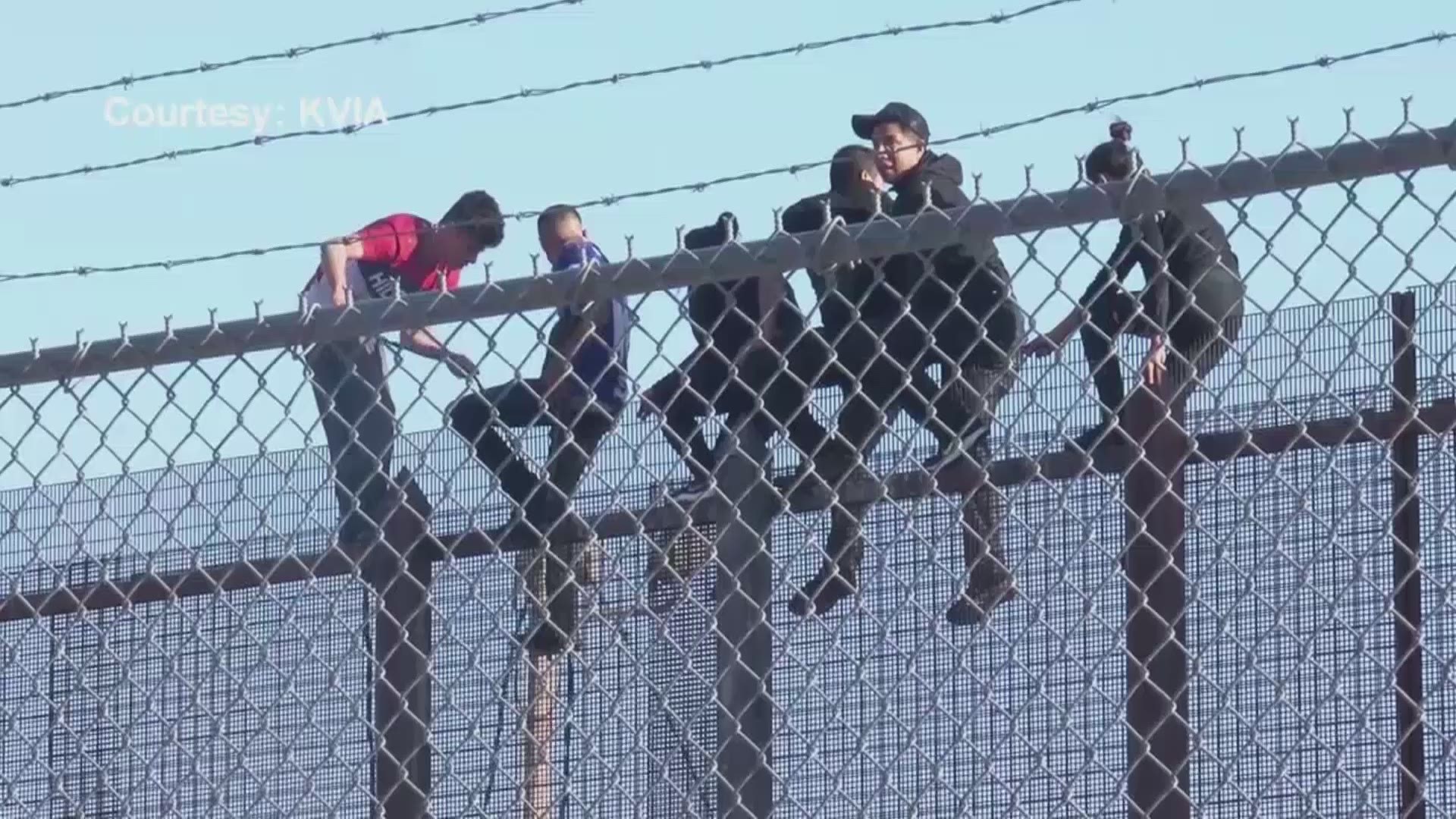 The group was climbing the border barrier not too far away from where a group of Border Patrol agents rescued a man stuck in a canal grate.