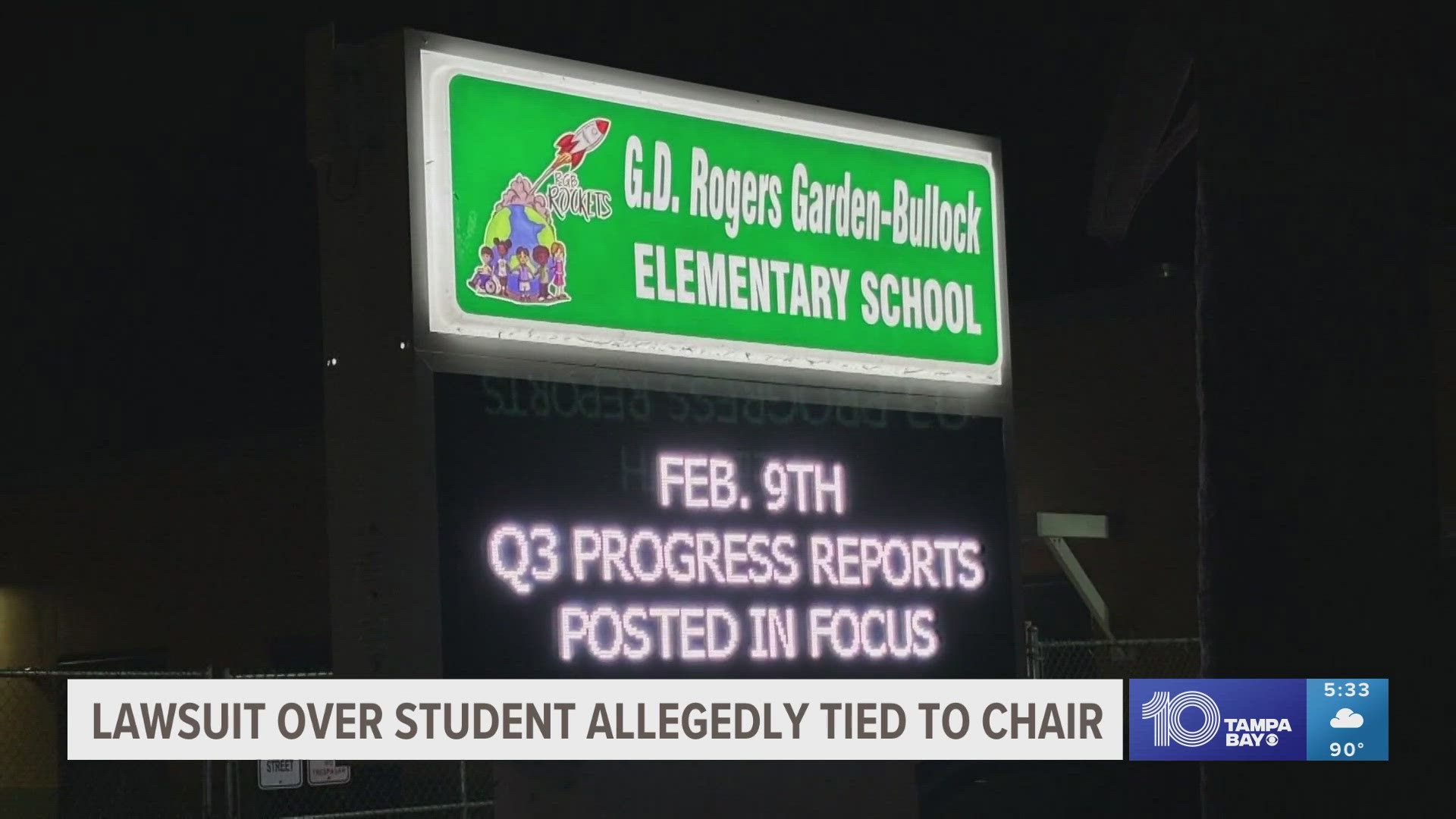 Police say security cameras allegedly show Takeila Jones' then-7-year-old son tied to a chair while several teachers sat on it to restrain him.