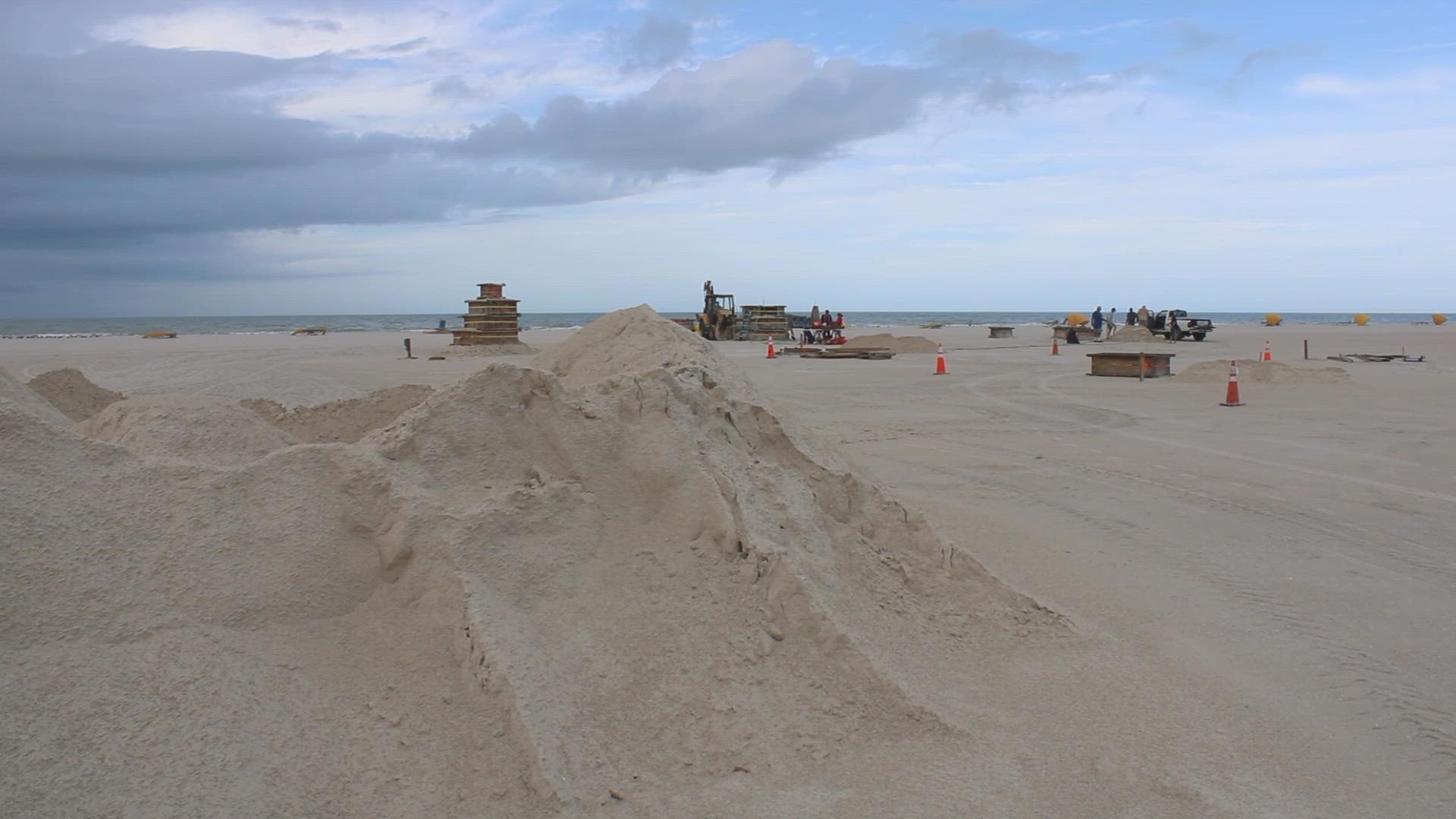 Sculptors worked hard at doing a pound-up, which involved creating a block of hard, moist, compact sand.