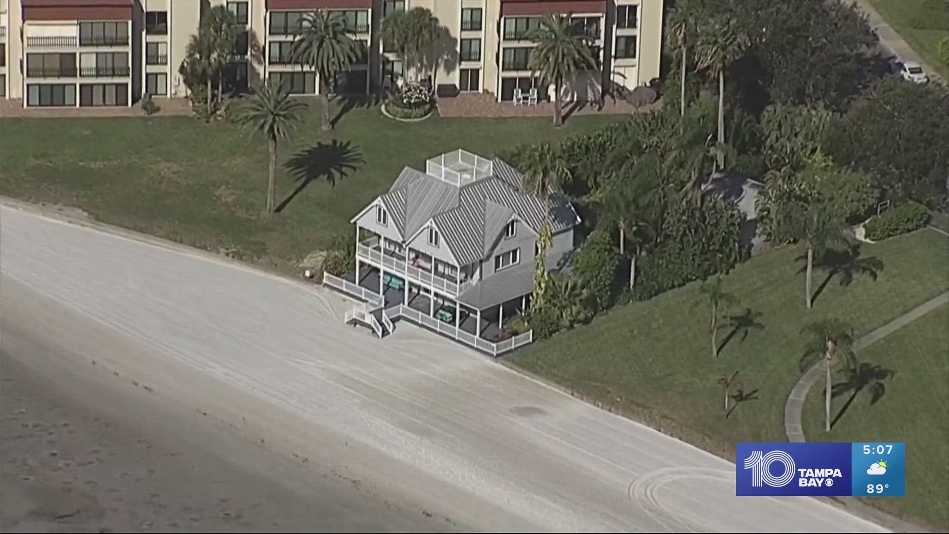 The single-family home sits right on the sand, meaning all you need to do is step down the few steps off the porch and you're on your own private beach.