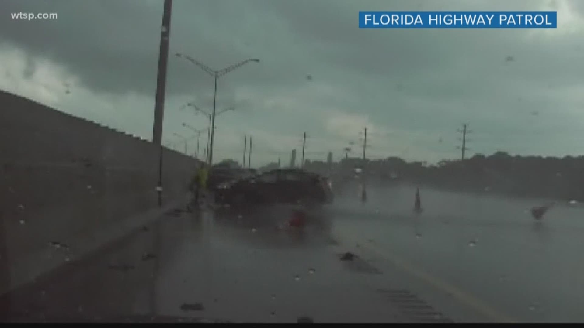The Florida Highway Patrol trooper jumped just in time before a hydroplaning car would've slammed into his body. Also, strong winds tip over an RV in Polk County; fortunately no one was hurt.