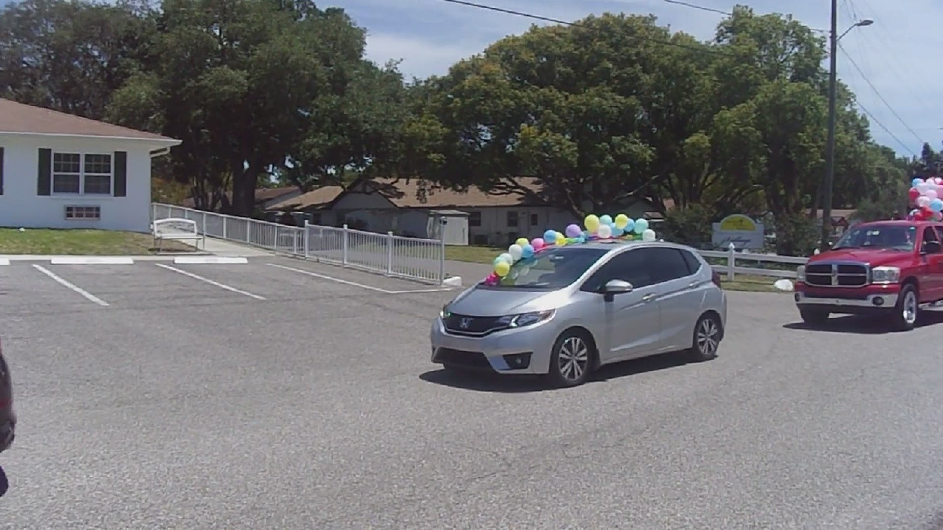 Family members grabbed their keys, balloons and signs to celebrate their loved ones.