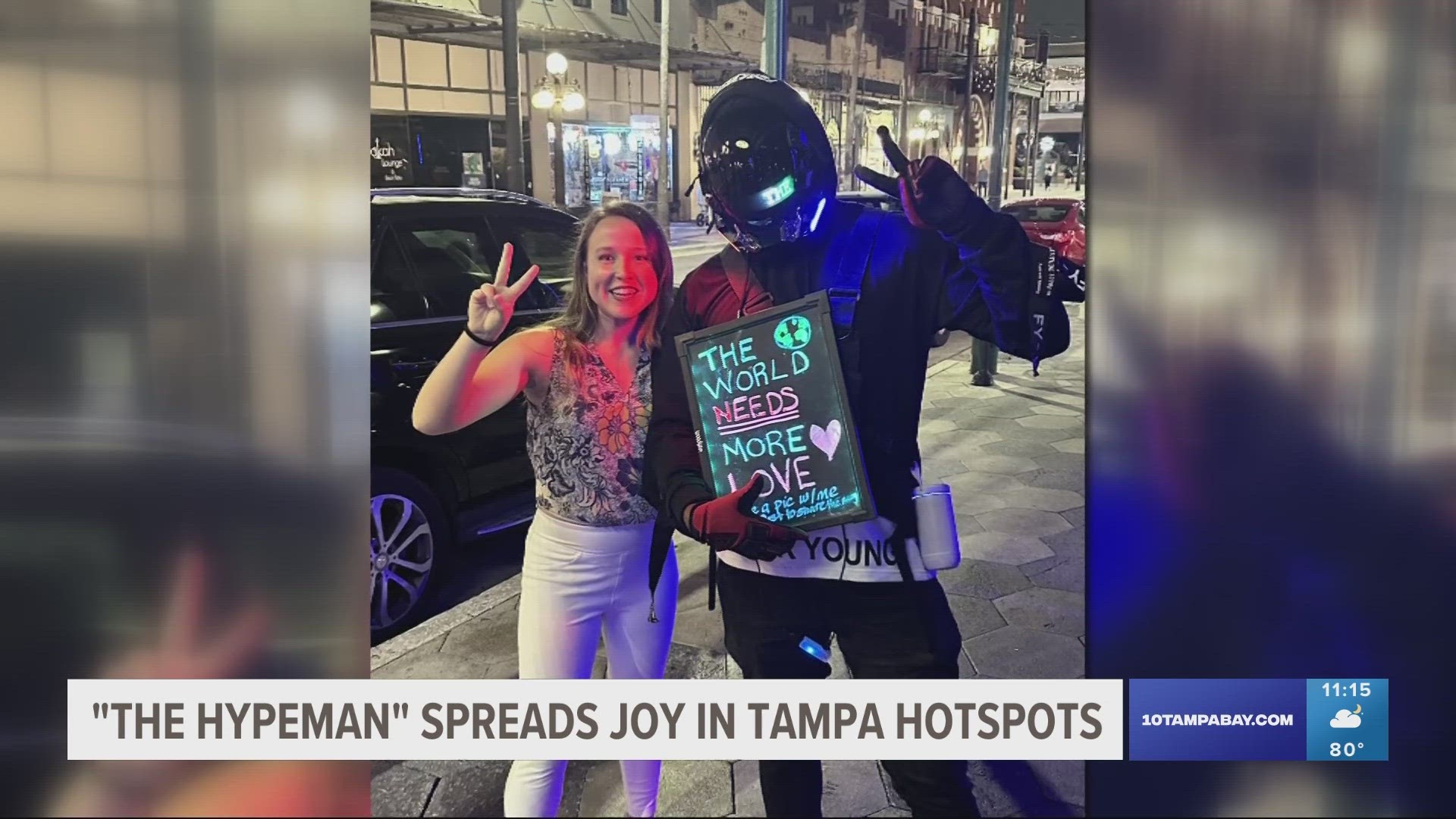 The mysterious man wanders through popular Tampa hotspots spreading positivity while carrying a sign that reads: “The world needs more love.”