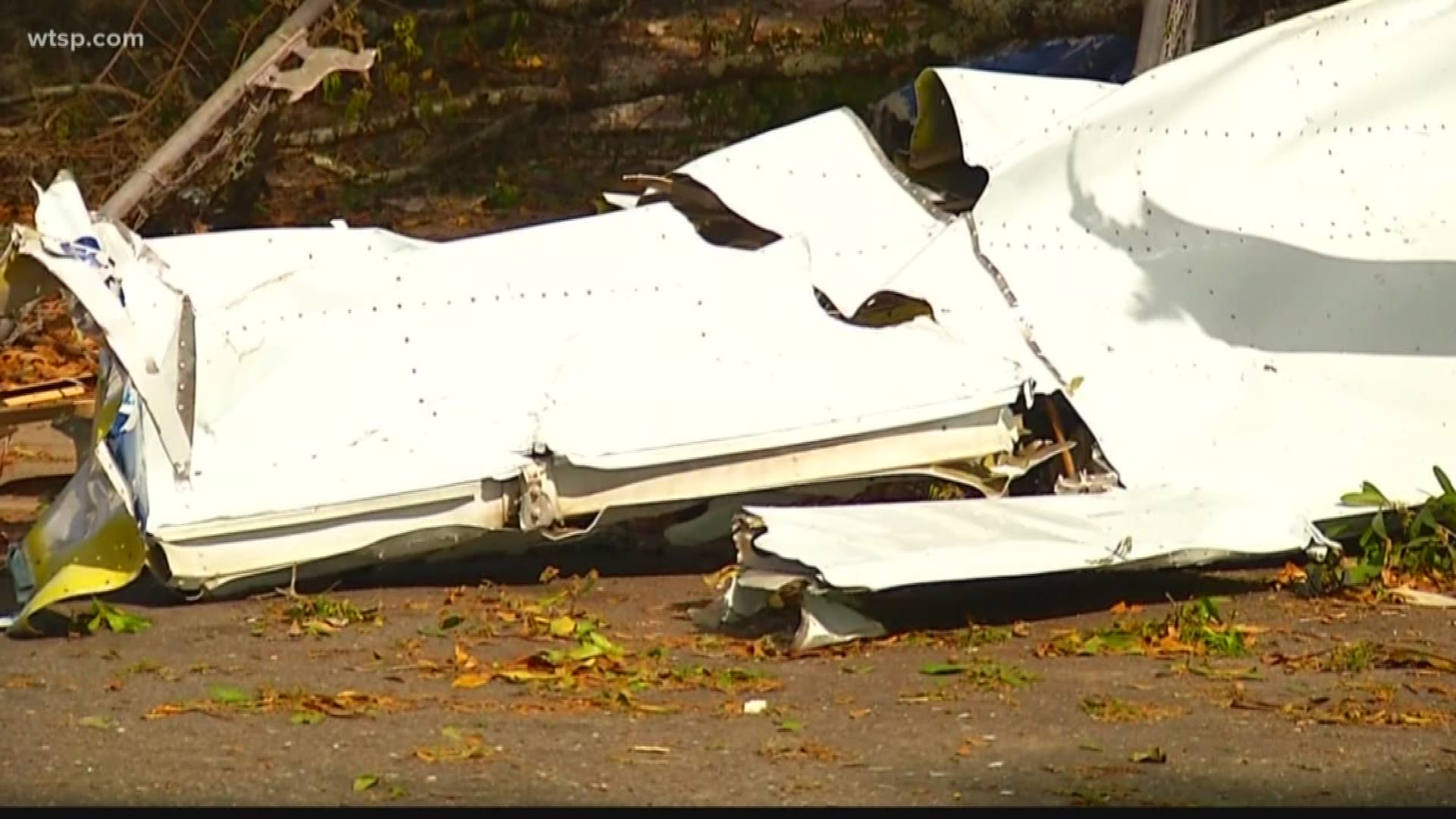 Two people are dead after the small plane they were in crashed down into a neighborhood Thursday in Polk County.