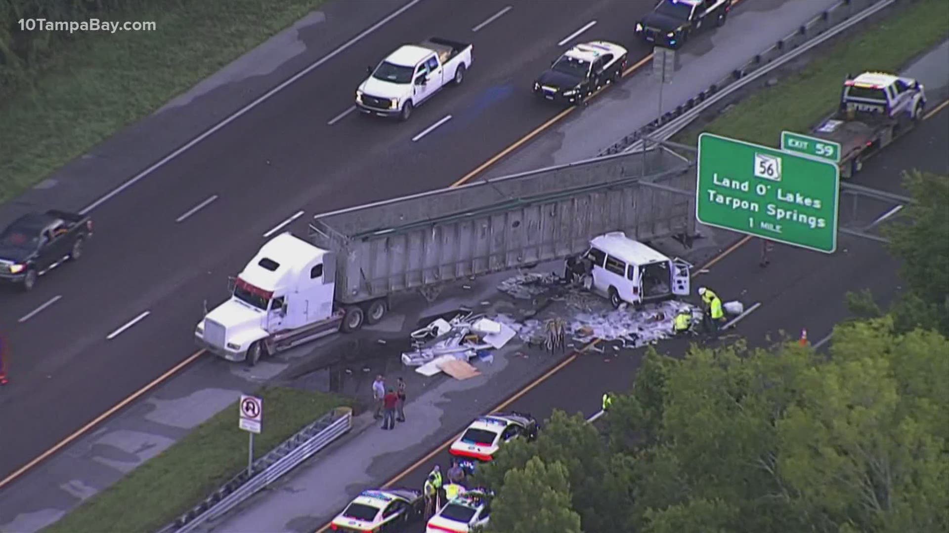 The northbound lanes on I-275 just before the Land O' Lakes and Tarpon Springs exit were blocked Monday morning after a crash between a van and semi-truck.