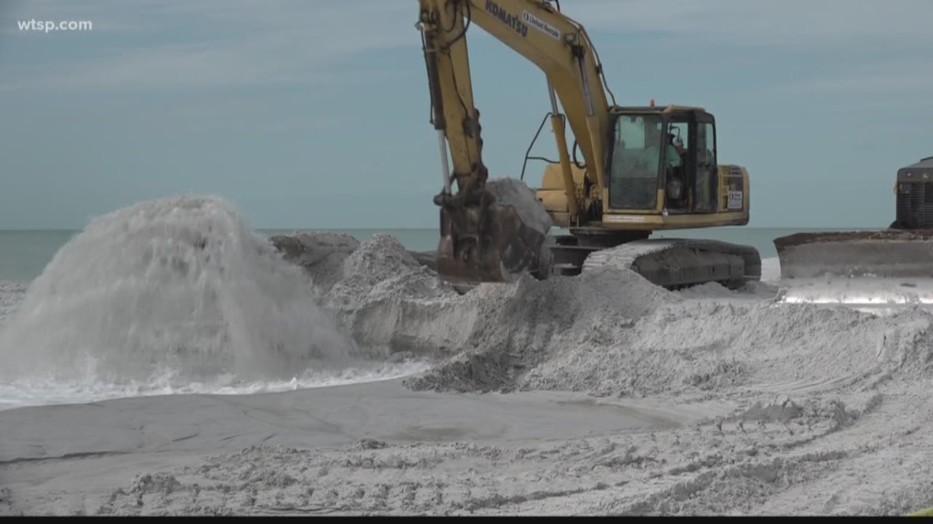 Crews have finished the public beach area and are now working along hotels and condominium complexes where they've lost all their beach front.