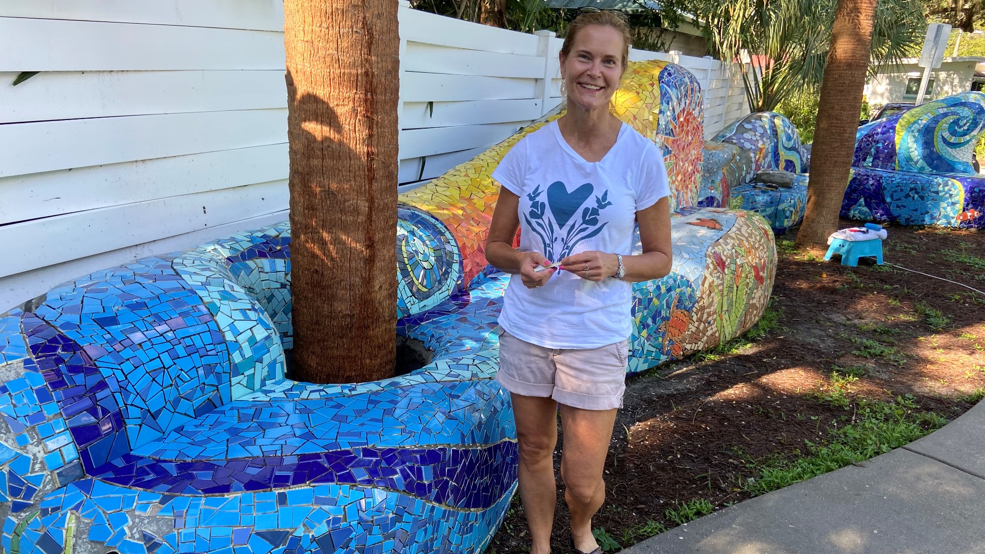 Melissa Haist is nearing completion of her 40-foot, 25,000-piece mosaic bench behind her shop and art gallery.