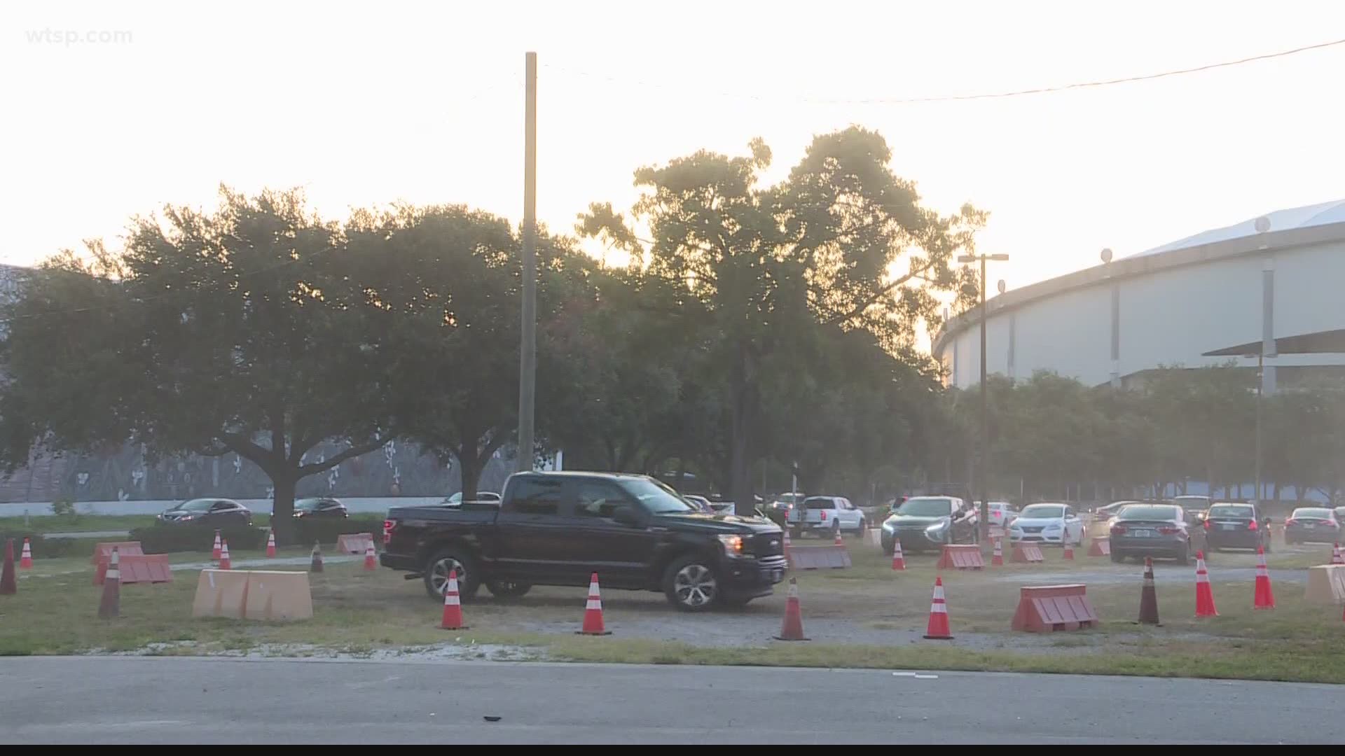 The new drive-thru testing site at Tropicana Field opened at 7 a.m. this morning, but closed in about an hour after it reached testing capacity.