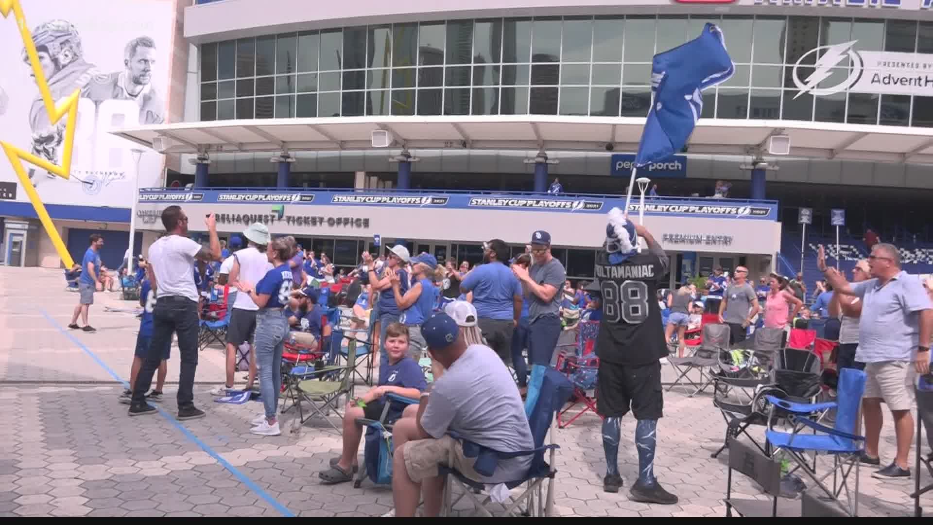 Hundreds of fans celebrate outside Amalie Arena as the Tampa Bay Lightning beat the Carolina Hurricanes.