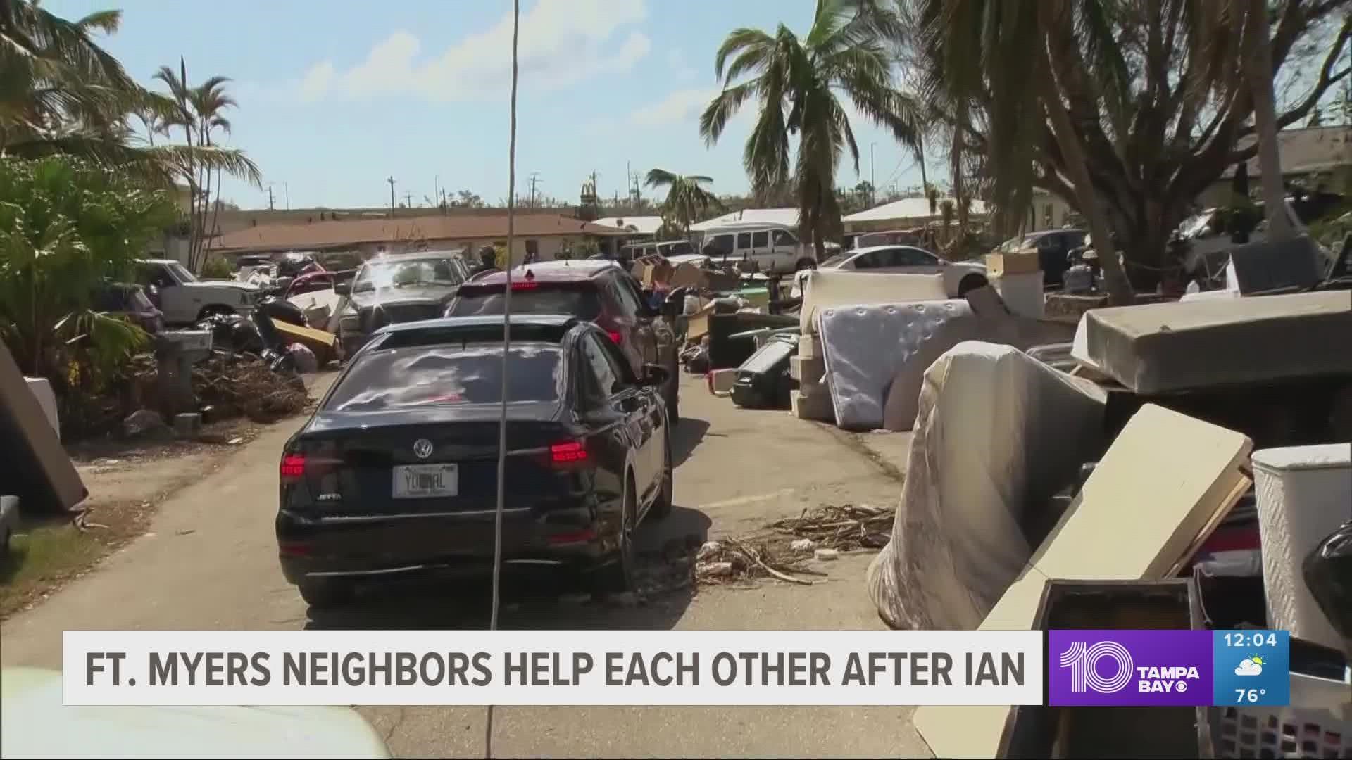 A week after Hurricane Ian's landfall, the streets of Fort Myers are lined with debris.