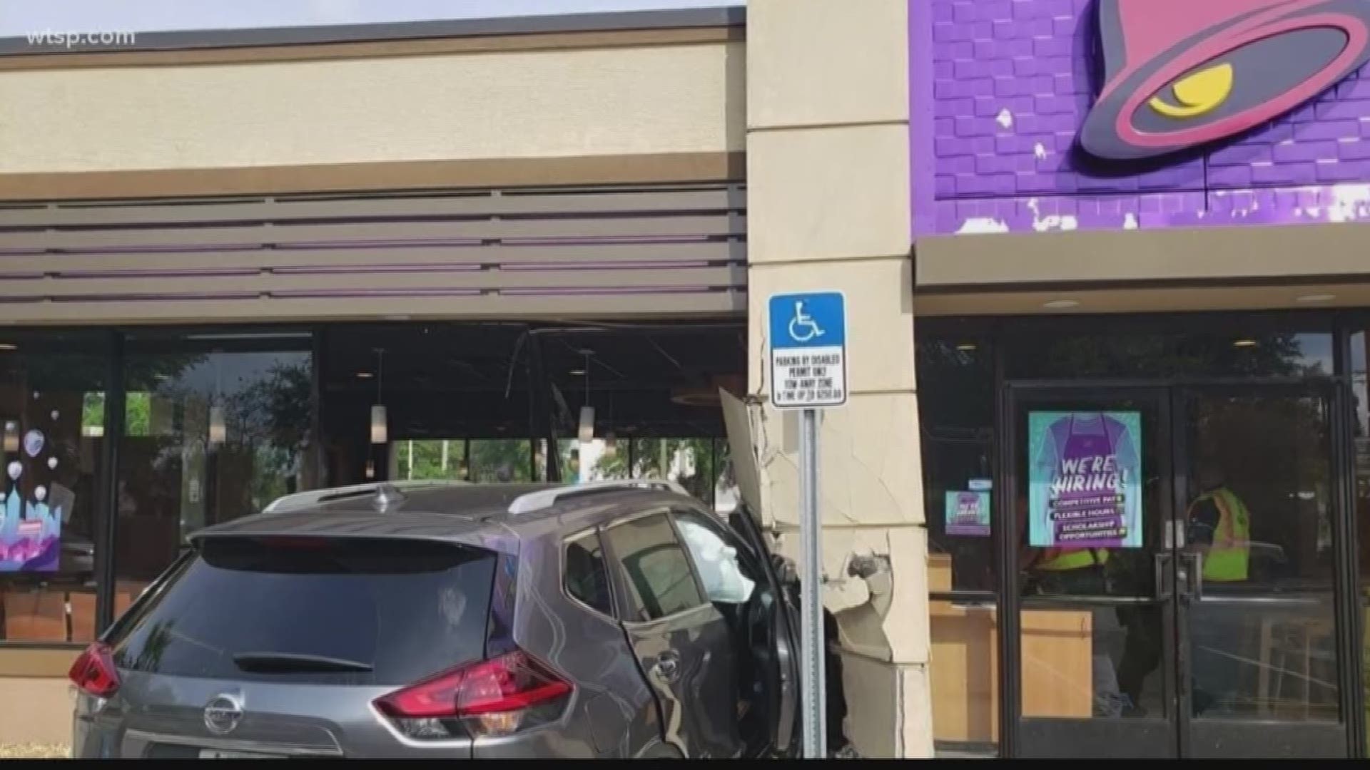 The need for hot sauce could be what came between one Taco Bell customer and a car that drove through the building, according to Winter Haven police.