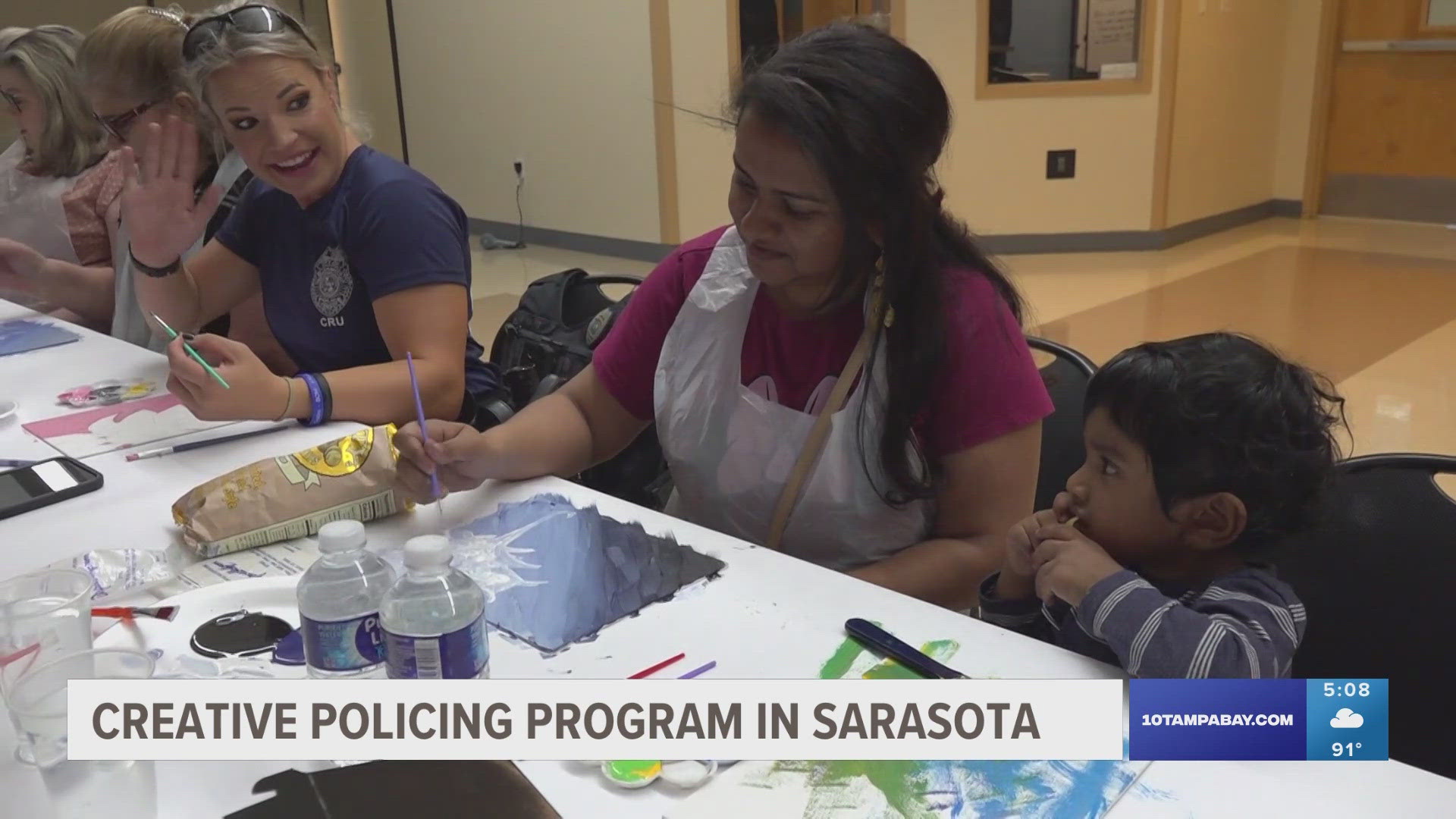 Through a dab of pain and the swoosh of a brush, "Paint with Police" aims to bring more positive interactions between officers and people in the community.