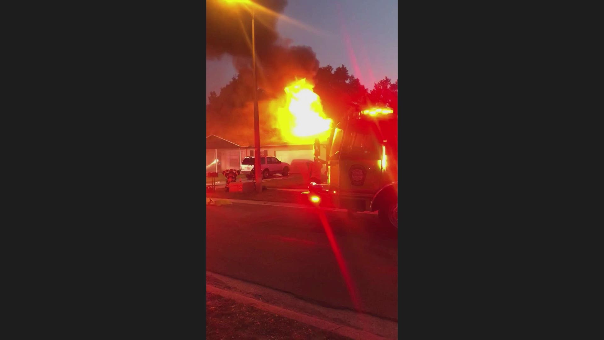 Video by Avery Ayan shows flames consuming a home in Valrico, Fla. A woman had to be rescued when she ran into the home to get medicine and collapsed.