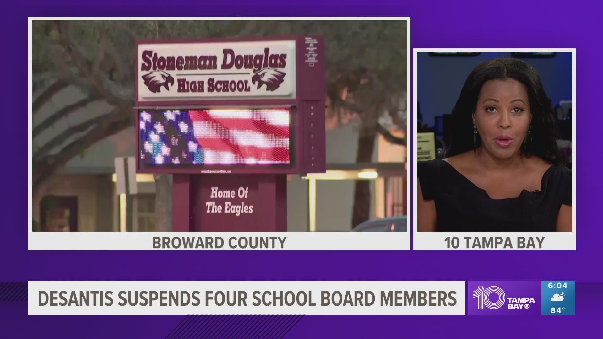 The suspended school board members were accused of "neglect of duty" and "misuse of authority".