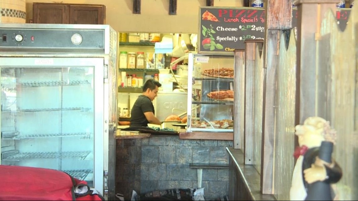 Inspector reports roaches crawling across clean pizza pans, utensils at