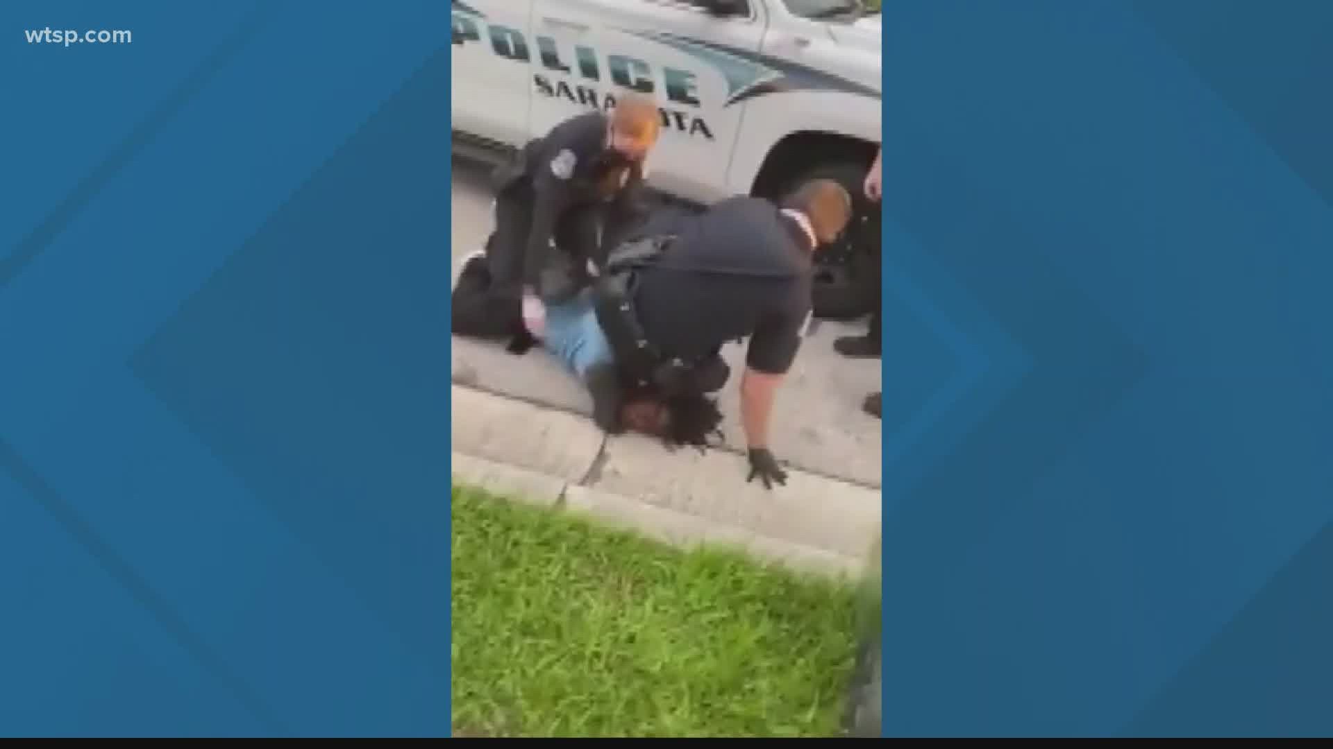 The Sarasota Police Department is investigating after one of its officers was accused of kneeling on the head and neck of a man being arrested.