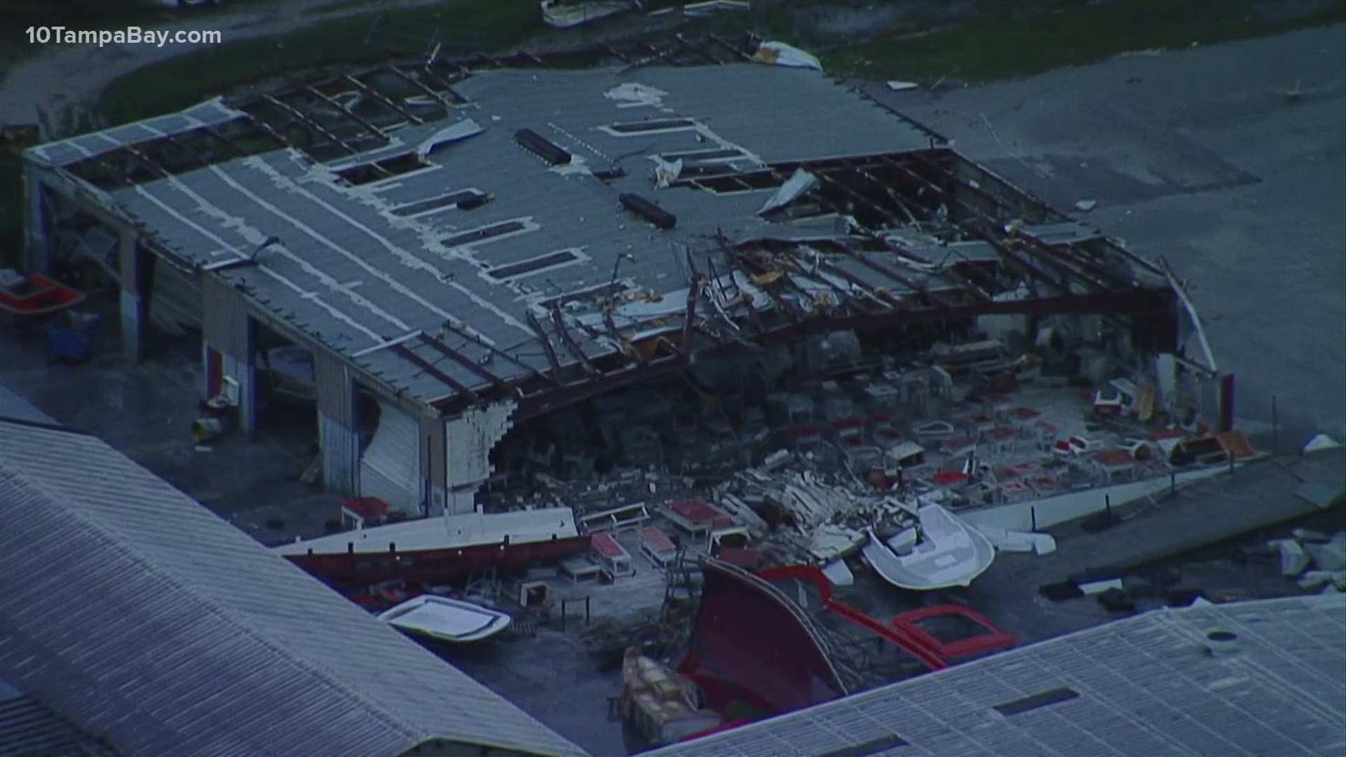 Scenes from Sky10 near Bryan Dairy Road and 66th Street show several buildings with roofs torn off and debris and boats thrown about.