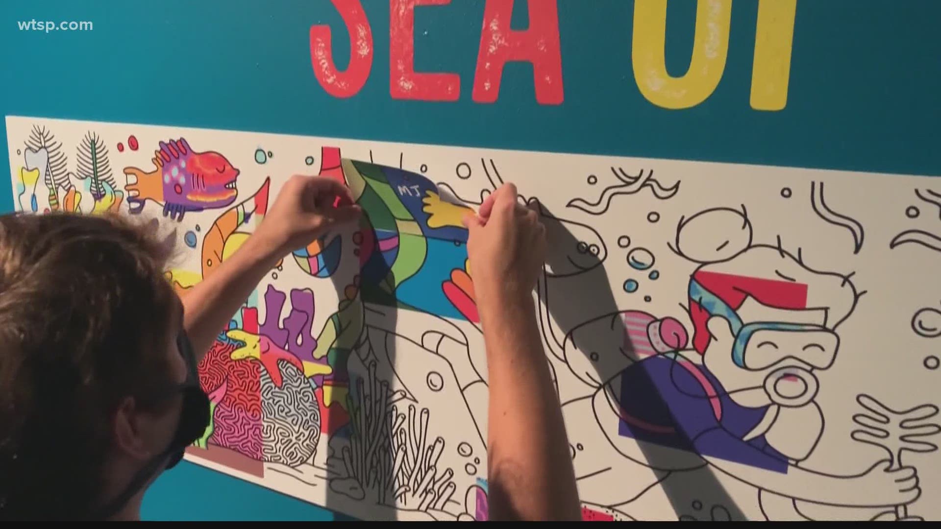 The Florida Aquarium debuted its "Sea Of Colors" mural on Monday to coincide with World Oceans Day.