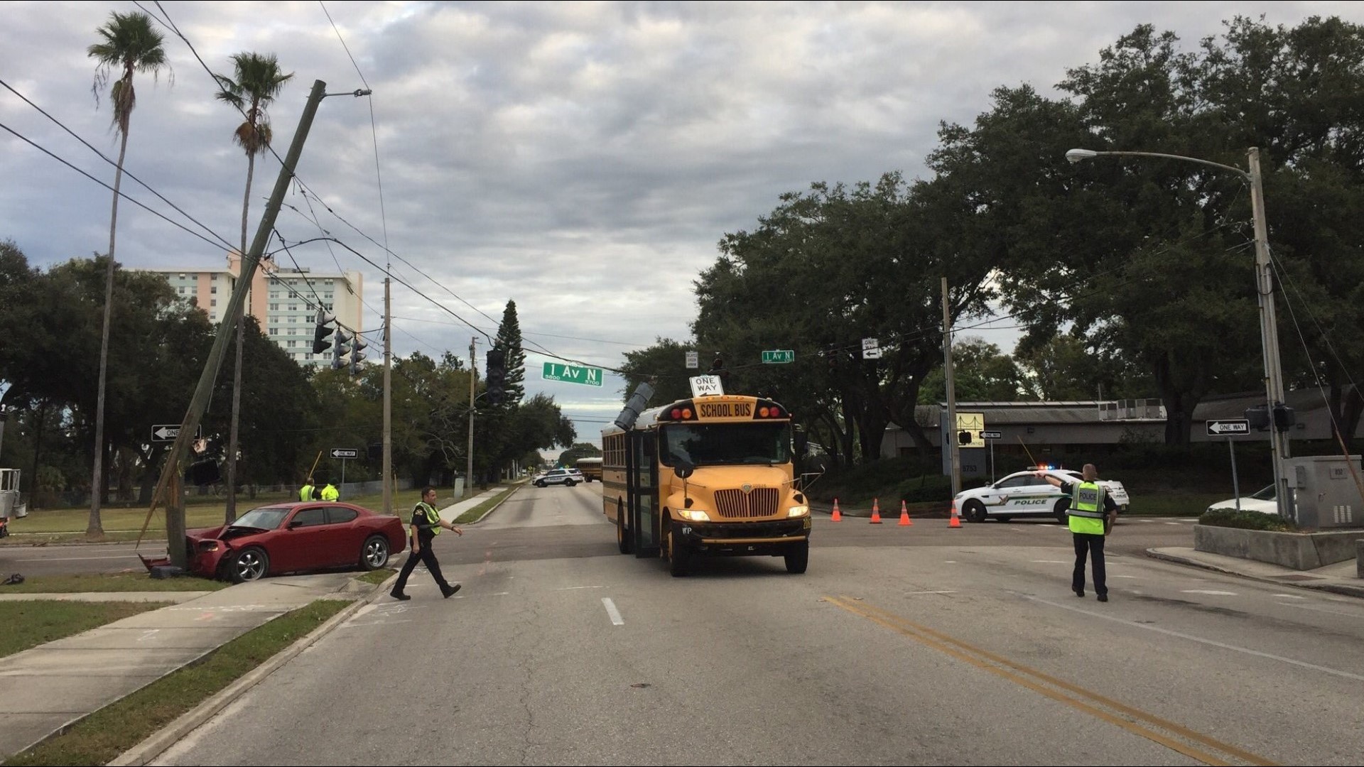 Traffic light strikes school bus after car crashes into pole in St ...