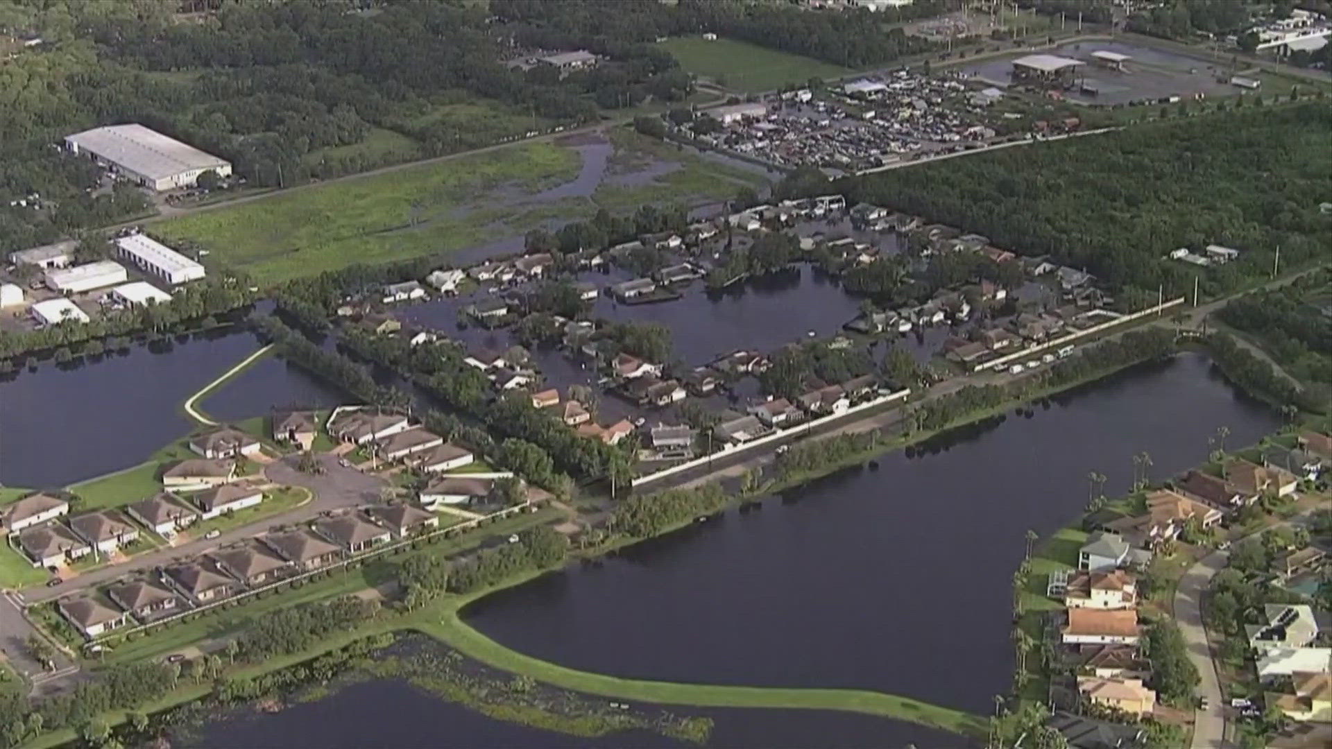 Neighborhoods and streets were still flooded Tuesday as a result of one-time Hurricane Debby.