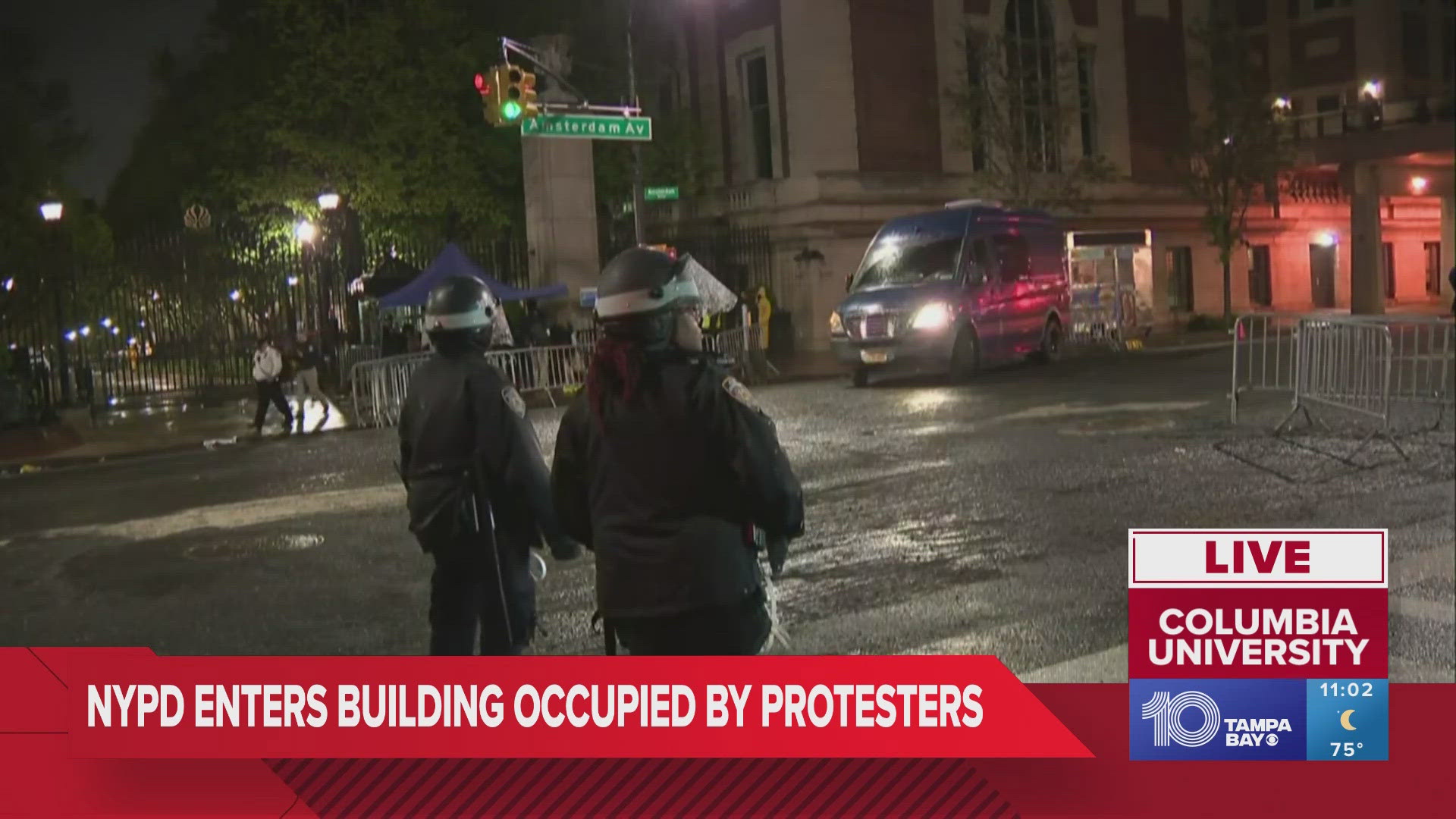Columbia University issued a shelter-in-place order Tuesday evening as scores of police officers in riot gear swarmed near the New York campus.