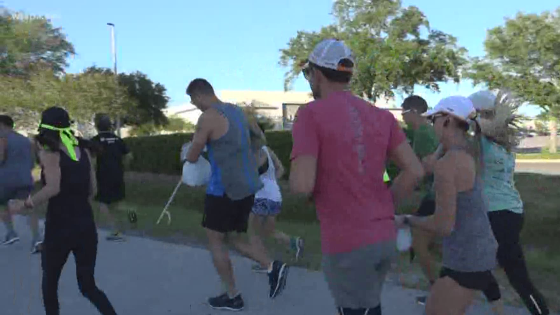 Joggers are picking up garbage, doing good while getting into shape.
