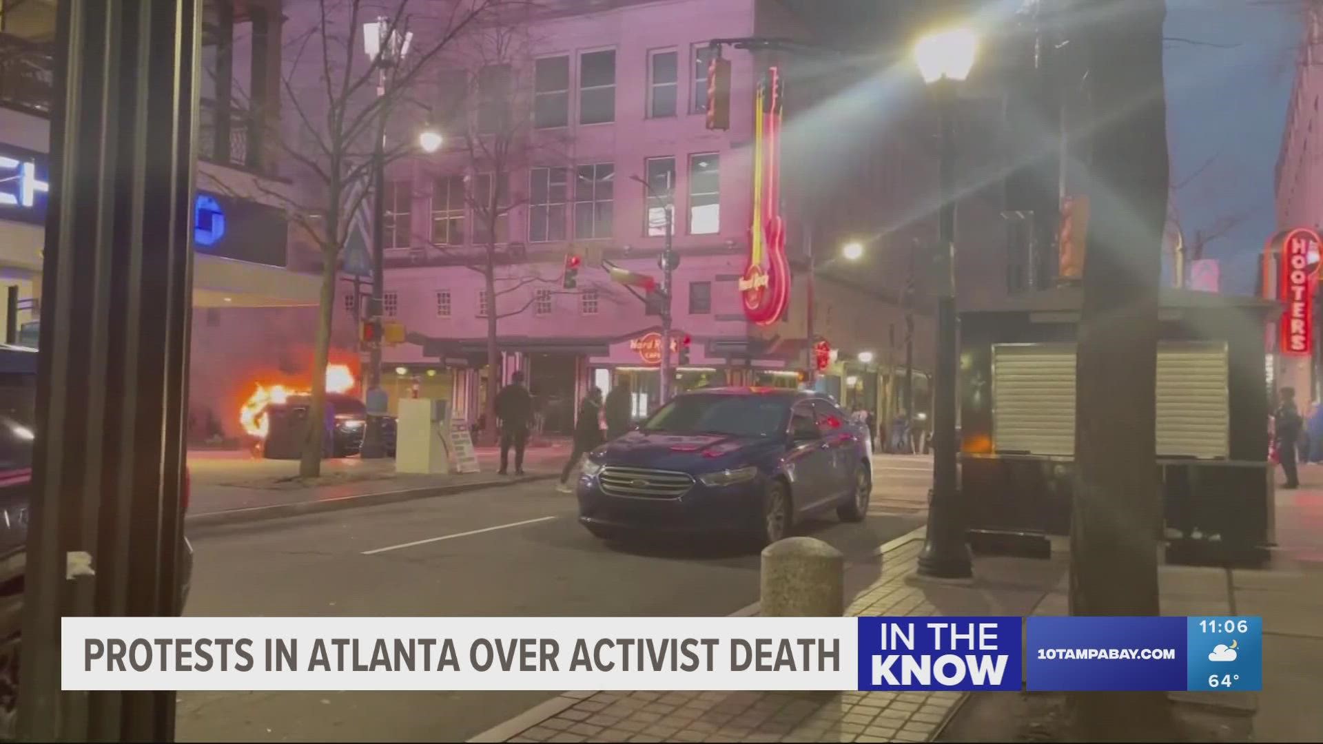 Activists threw rocks and reportedly lit fireworks in front of a building that houses the Atlanta Police Foundation.