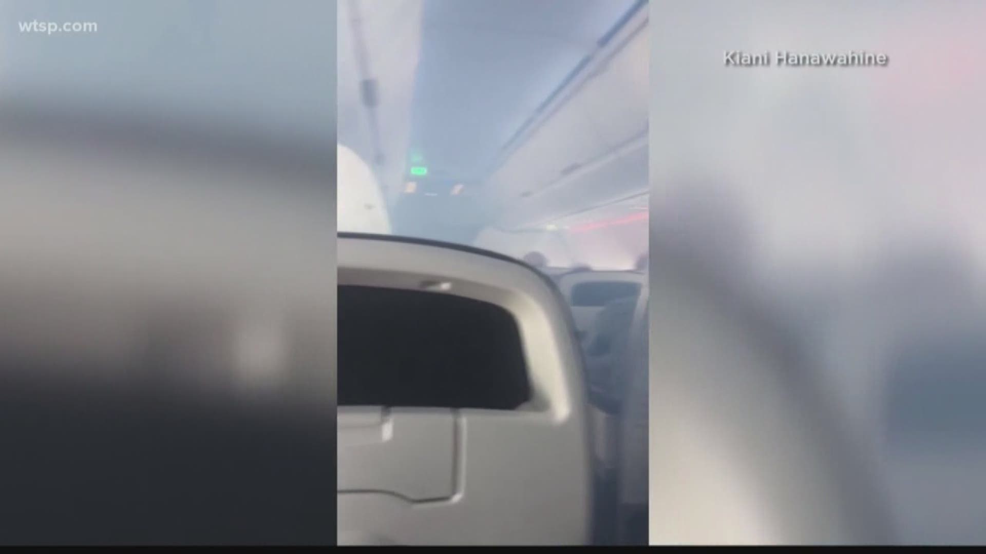 Authorities say passengers on a Hawaiian Airlines flight from Oakland, California, to Honolulu used emergency slides to evacuate on a runway after a report of possible smoke or fire in the aircraft's cargo area.