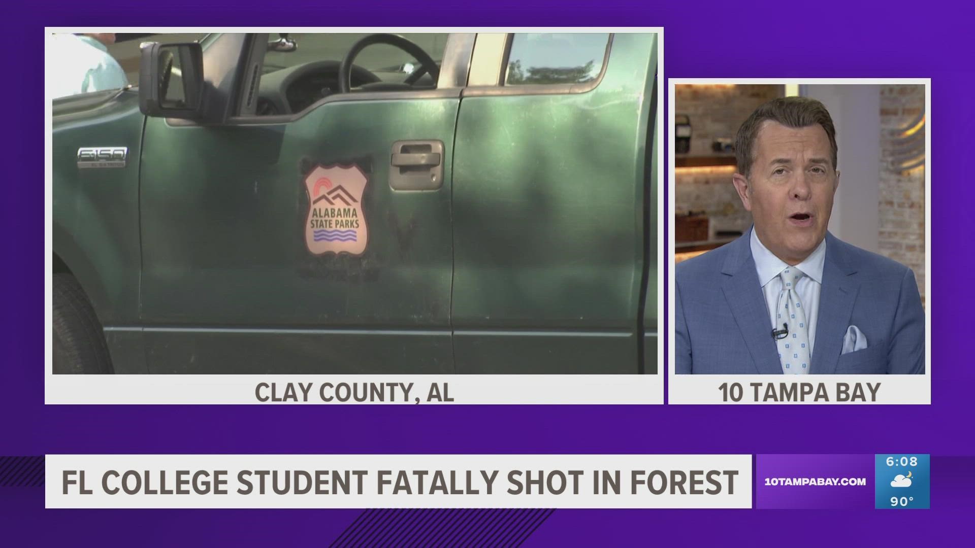 The student, traveling through the Alabama forest with his girlfriend, stopped his car by the would-be robber, authorities said.