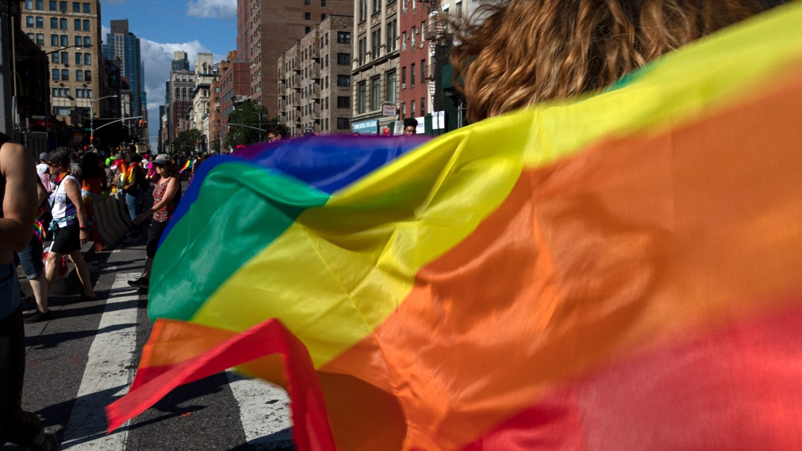 obama and biden carry gay pride flags around white house