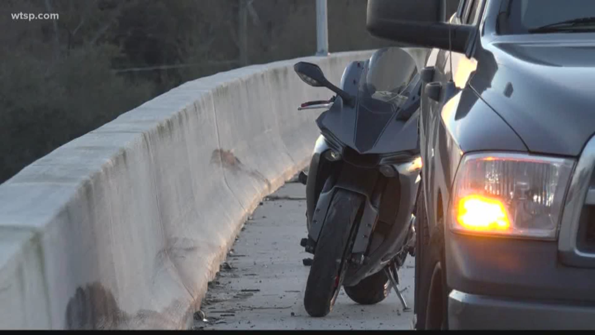 Troopers say the cyclist rode off, abandoning his passenger, after striking another motorcycle, sending its driver off an overpass.