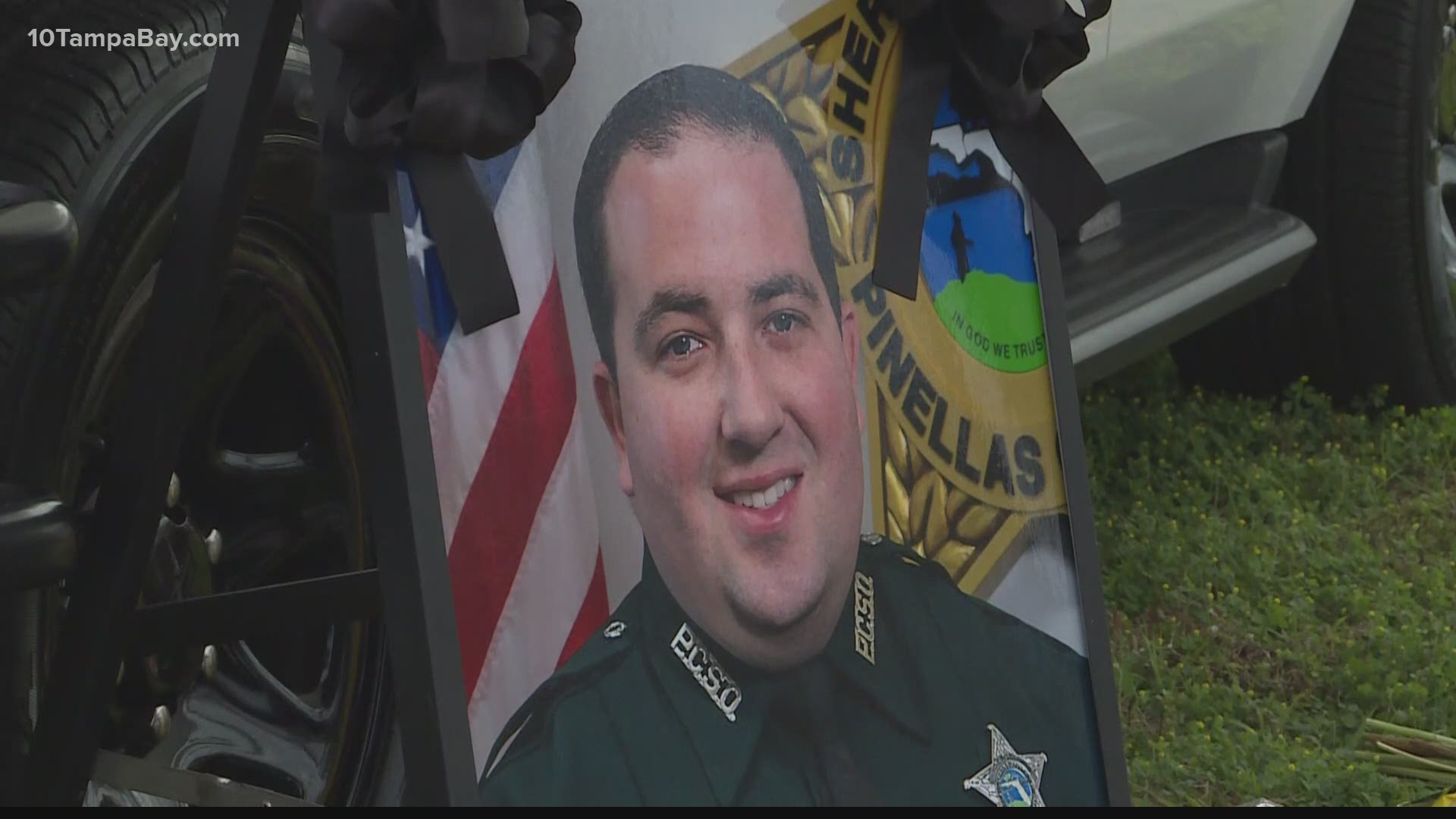 Friends and coworkers came together to build Magli's memorial in front of the sheriff's office before the procession to the funeral home began