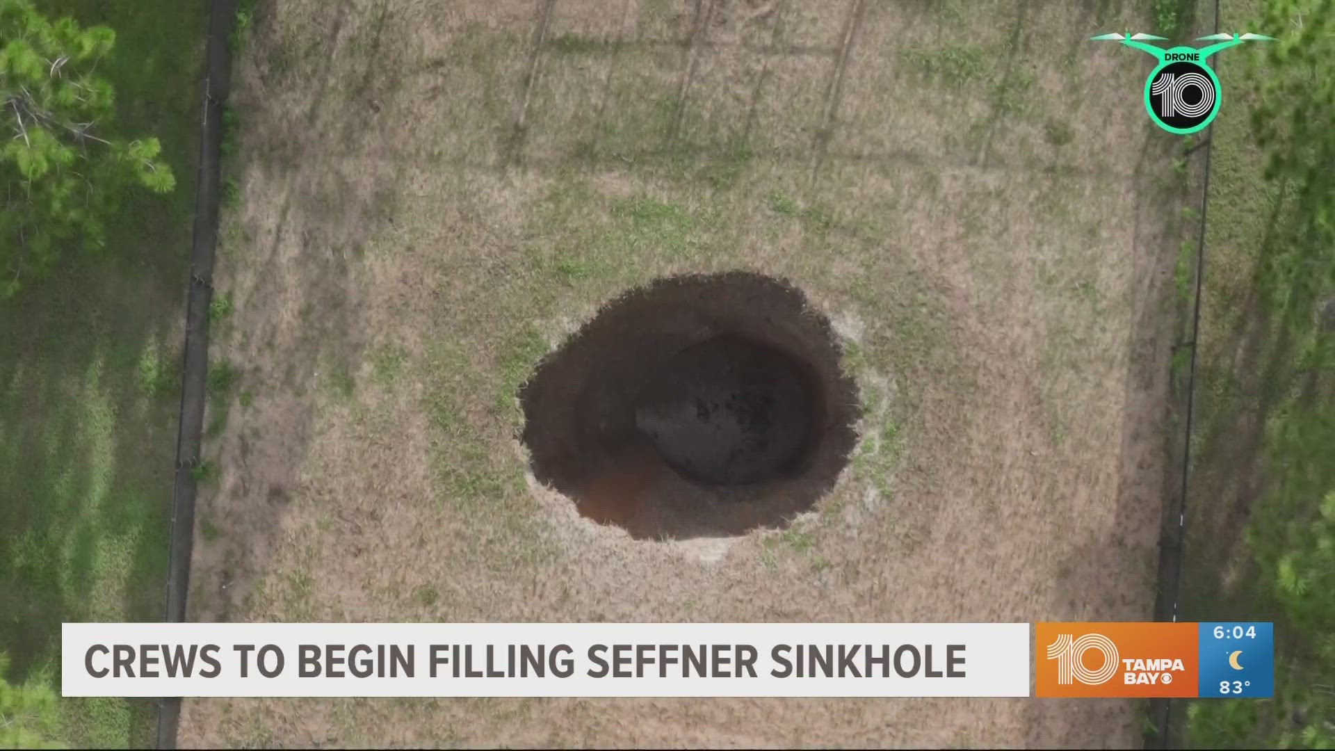 The 19-foot sinkhole that showed movement Monday appeared not to increase in size overnight.